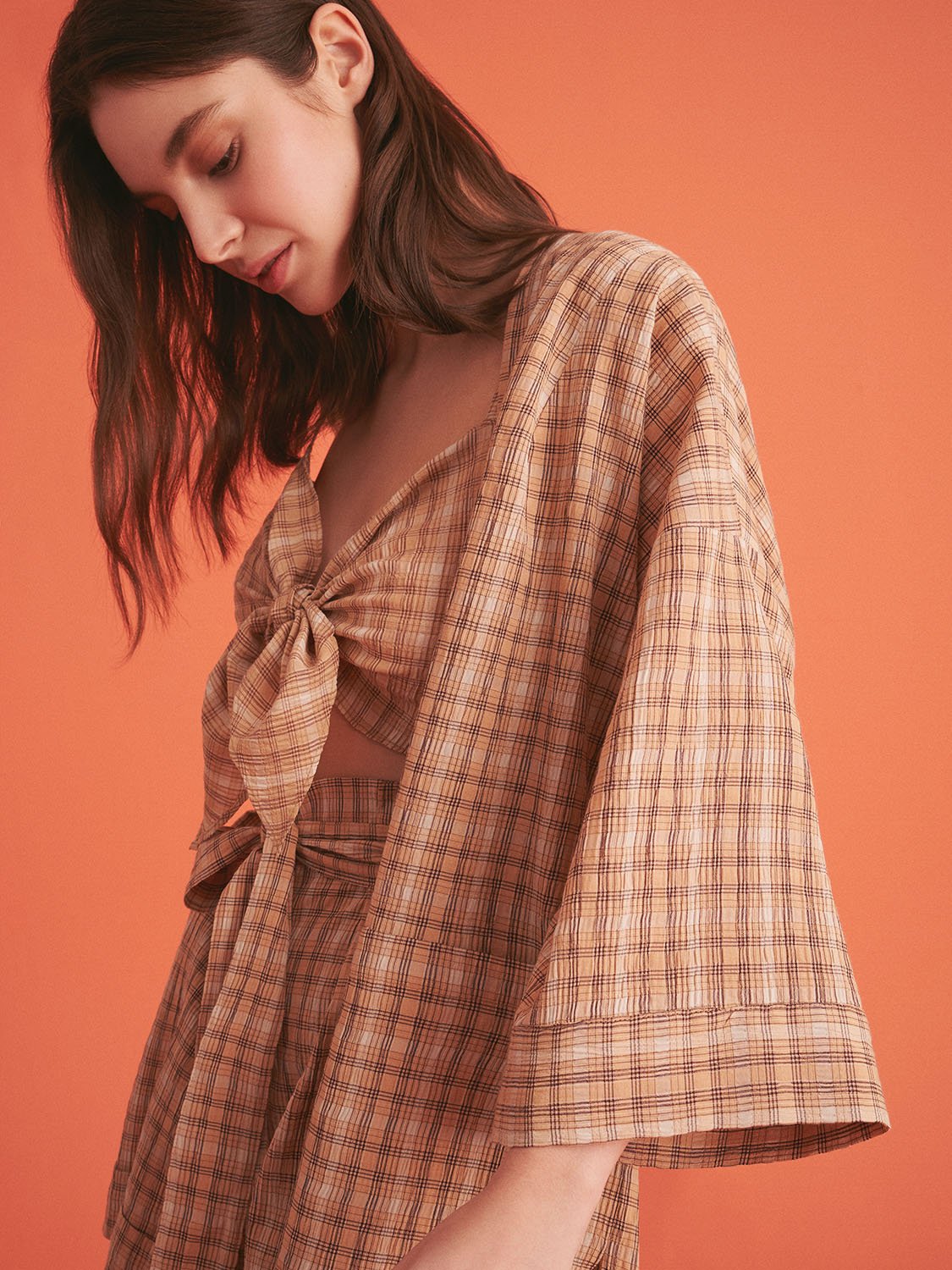 A stylish Dropped Shoulder Plaid Kimono with elbow-length sleeves, featuring patch pockets and side slits, perfect for summer wear.