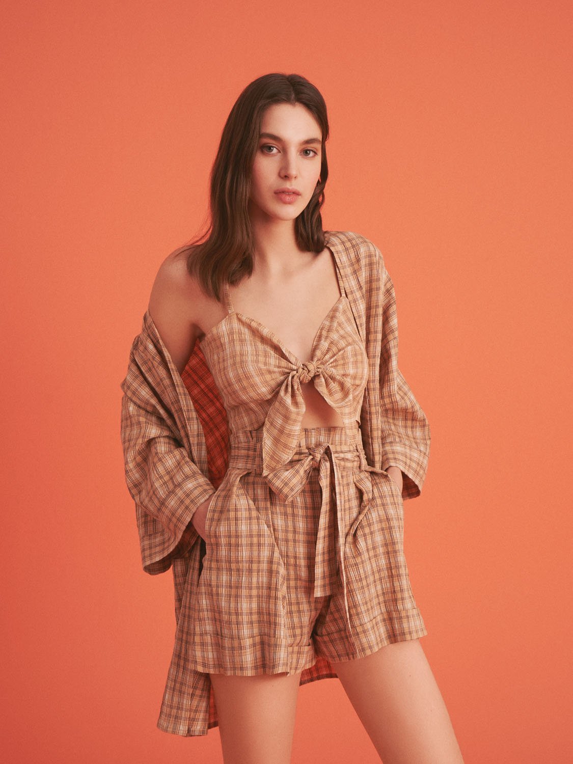 A stylish Dropped Shoulder Plaid Kimono with elbow-length sleeves, featuring patch pockets and side slits, perfect for summer wear.