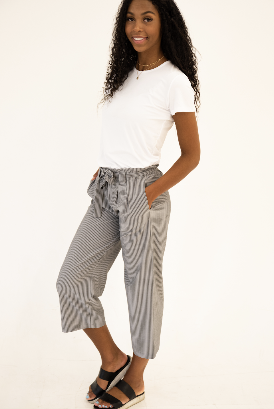 DT Izzy Belted Striped Palazzo Pants in grey and white, showcasing a stylish design with a belt and wide legs.