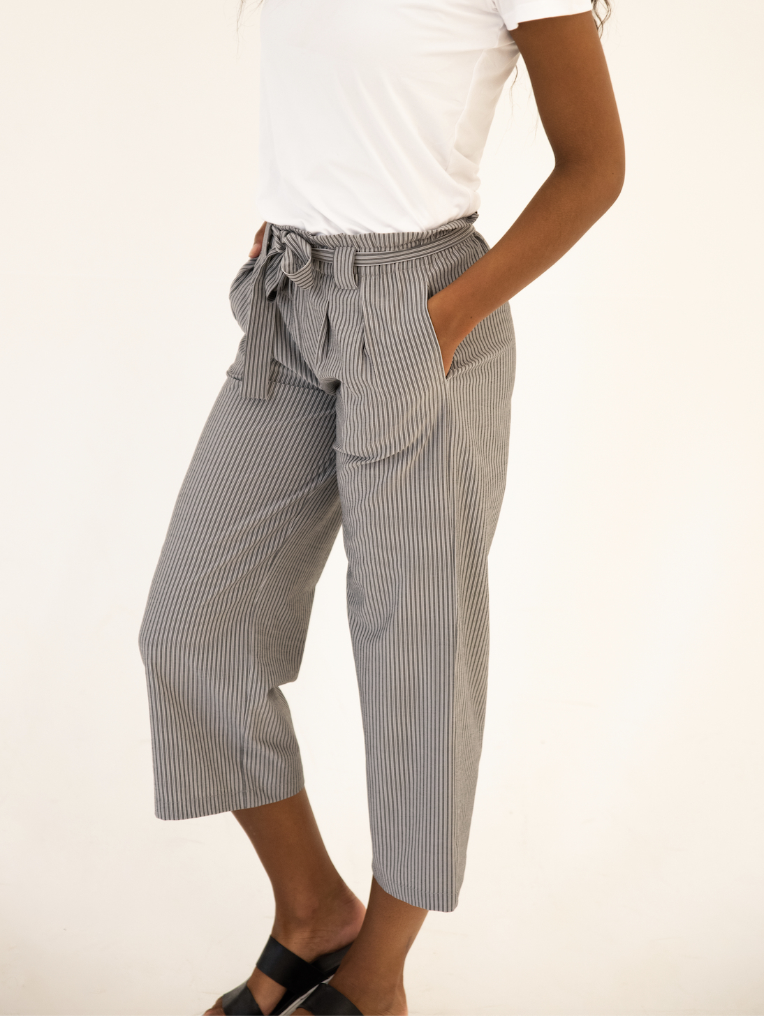 DT Izzy Belted Striped Palazzo Pants in grey and white, showcasing a stylish design with a belt and wide legs.