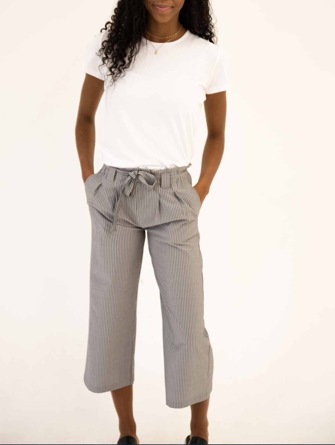 DT Izzy Belted Striped Palazzo Pants in grey and white, showcasing a stylish design with a belt and wide legs.