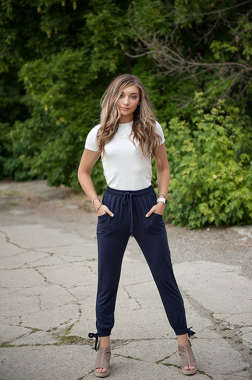 DT Shelby Tie-ankle pants in Navy featuring a feminine knot at the ankle, adjustable drawstring waistband, and functional pockets.