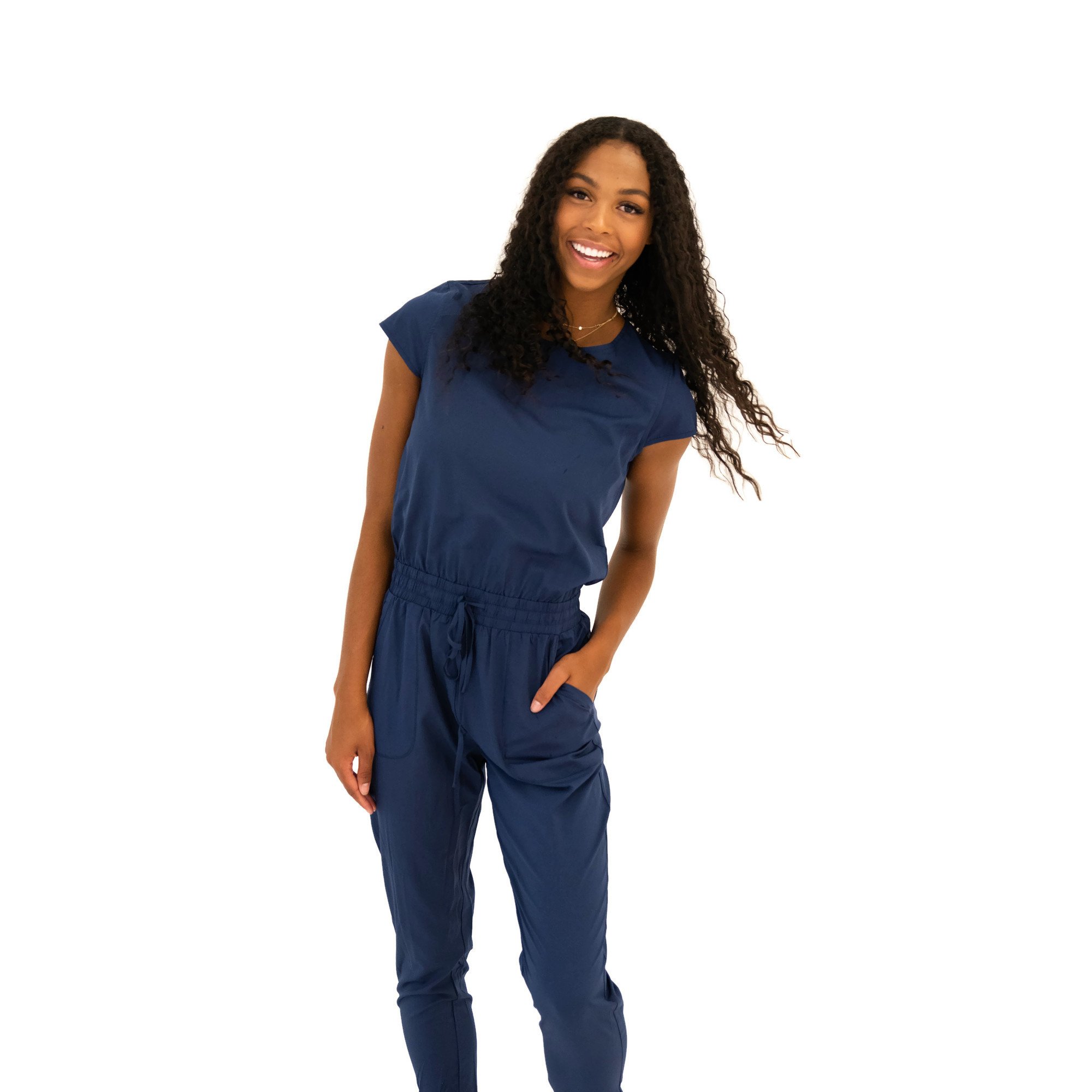 DT Unity Jumpsuit in Navy featuring cap sleeves, elastic waist, and slim cut legs, perfect for women and teens.