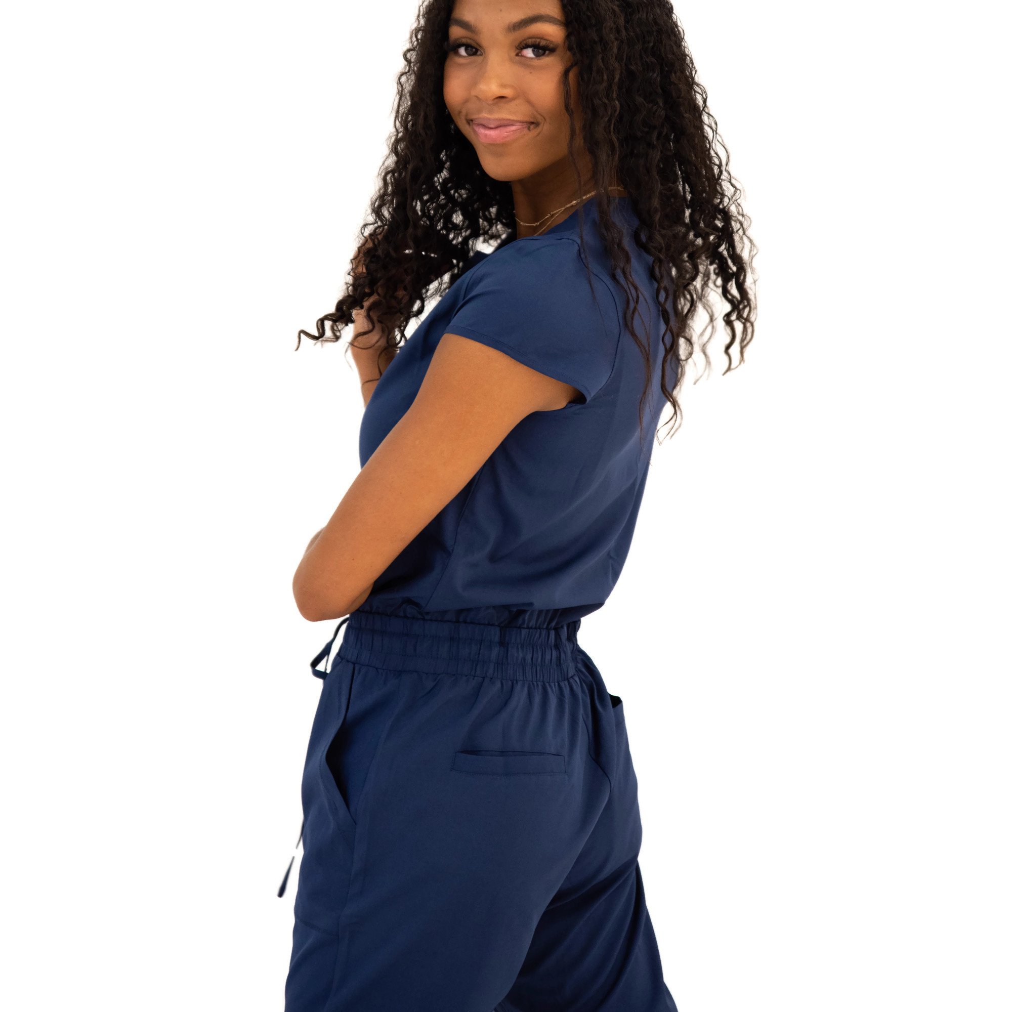 DT Unity Jumpsuit in Navy featuring cap sleeves, elastic waist, and slim cut legs, perfect for women and teens.