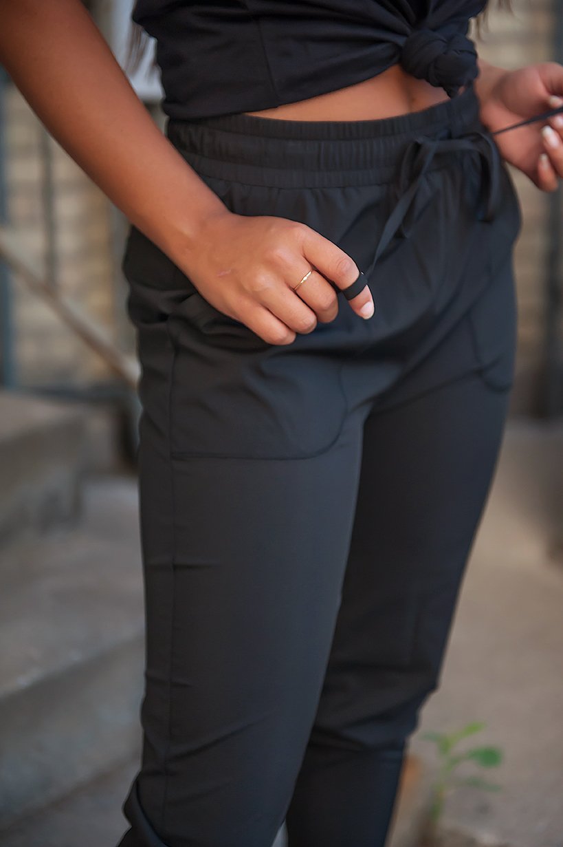 DT UPTOWN Lightweight Joggers in Black featuring a drawstring waist and pockets, designed for comfort and style.