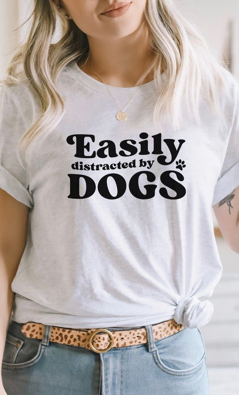 Easily Distracted By Dogs Graphic Tee featuring a paw print design, available in various colors.