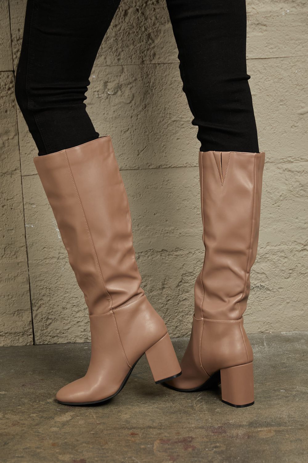 East Lion Corp Block Heel Knee High Boots in luxurious faux leather, featuring a stylish knee-high design and sturdy block heel.