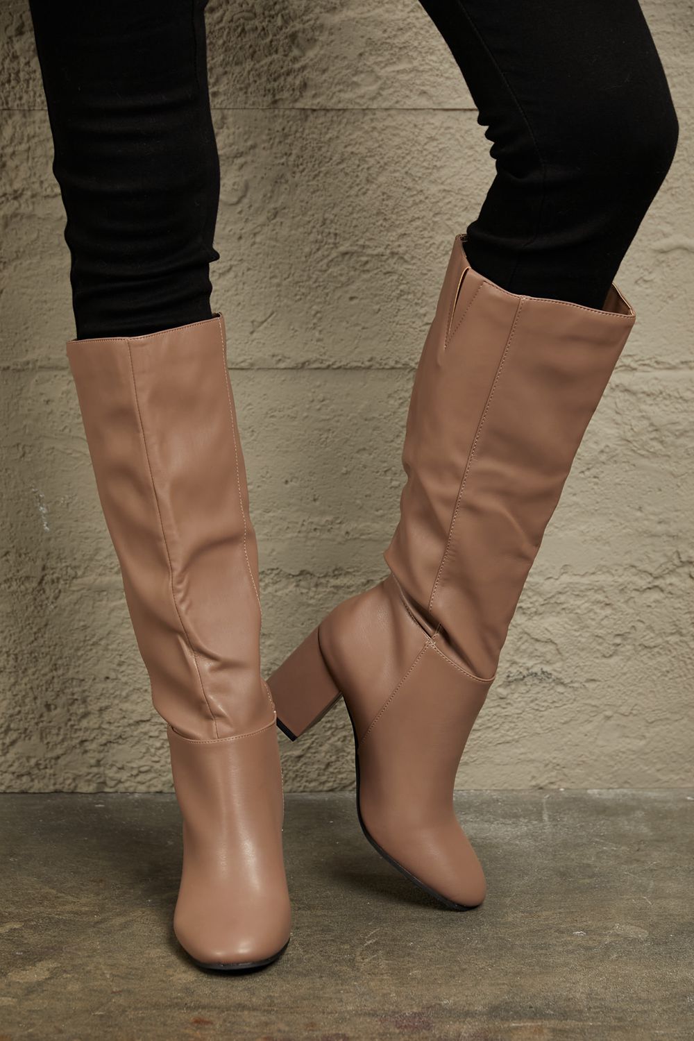 East Lion Corp Block Heel Knee High Boots in luxurious faux leather, featuring a stylish knee-high design and sturdy block heel.