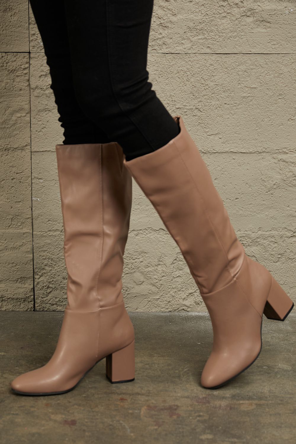 East Lion Corp Block Heel Knee High Boots in luxurious faux leather, featuring a stylish knee-high design and sturdy block heel.