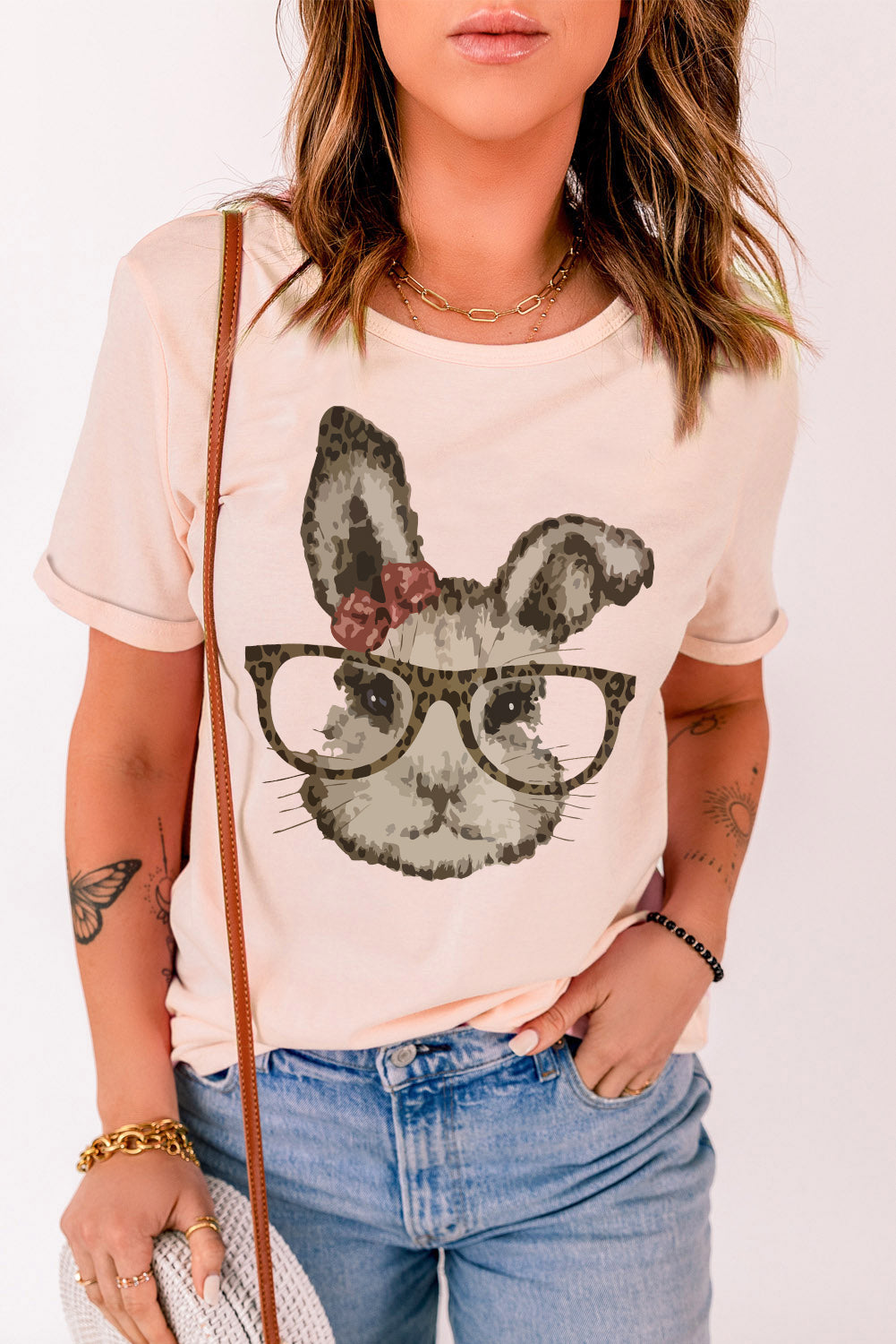 Easter Bunny Graphic Cuffed T-Shirt featuring a playful bunny design, round neck, and short sleeves, perfect for casual wear.