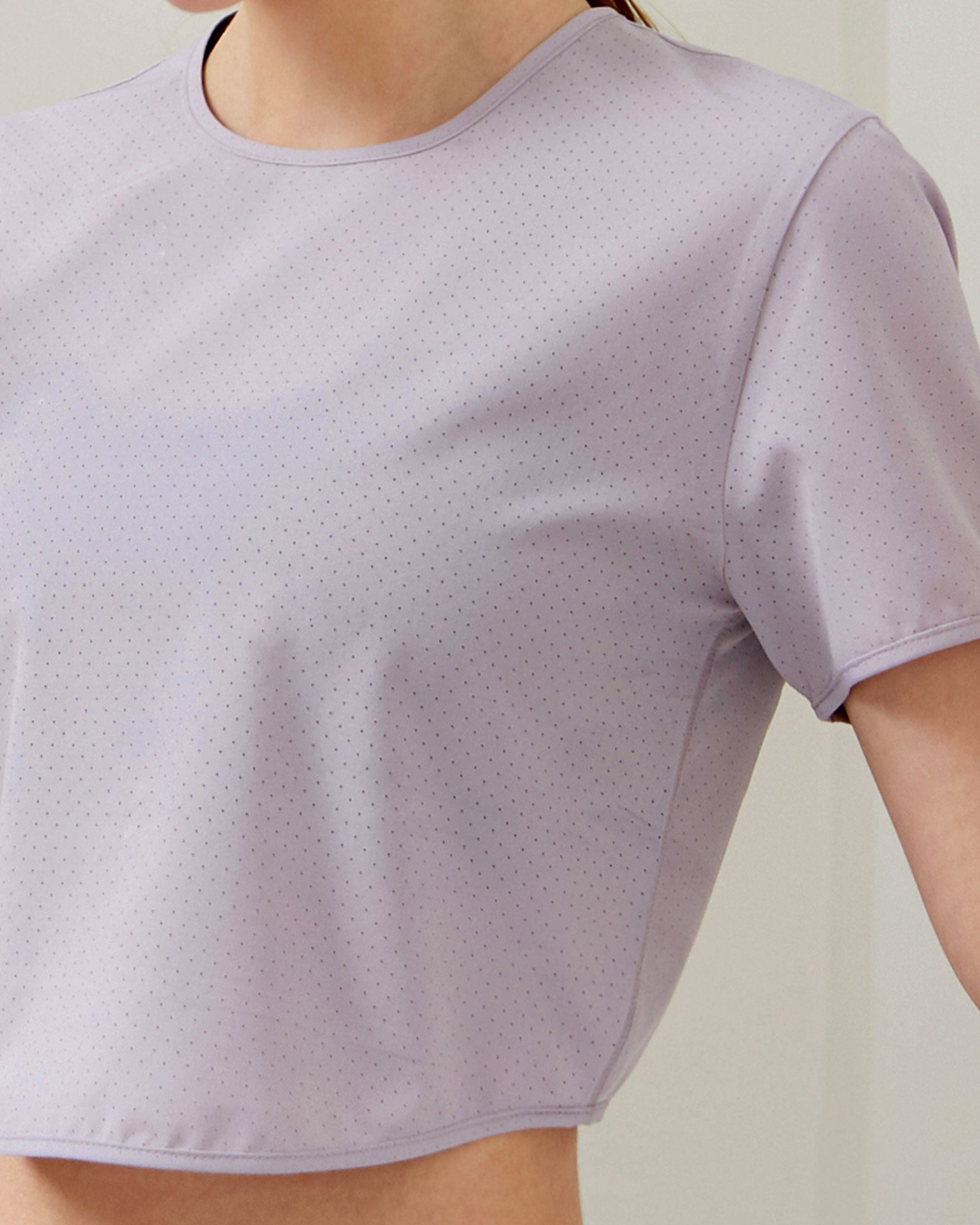 Echo Laser Cut Mesh Crop Tee featuring breathable mesh design and stretch fabric, perfect for workouts.