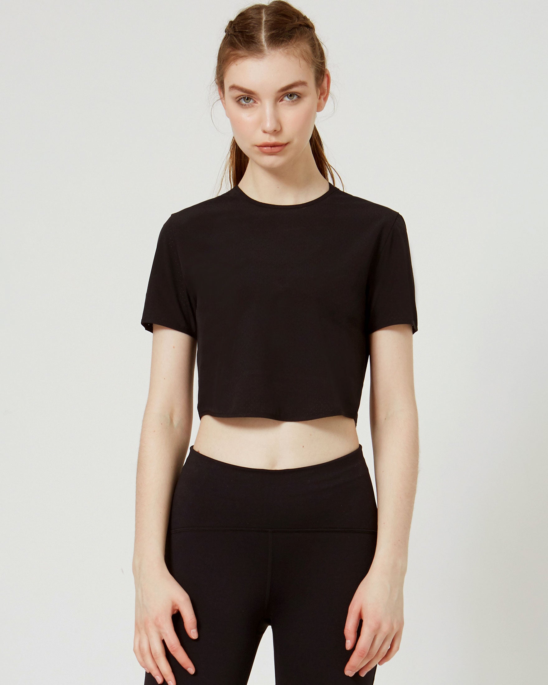 Echo Laser Cut Mesh Crop Tee featuring breathable mesh design and stretch fabric, perfect for workouts.