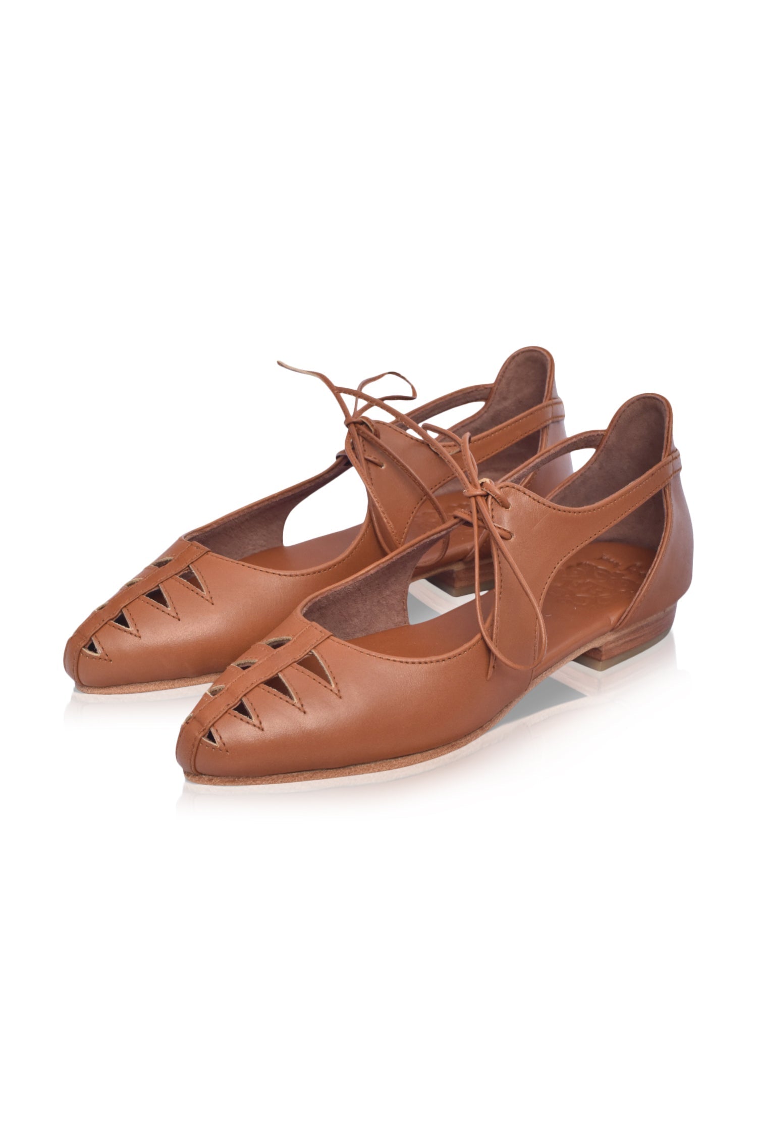 Eden Pointy Toe Ballet Flats in genuine leather with unique cutouts, showcasing a stylish and elegant design.