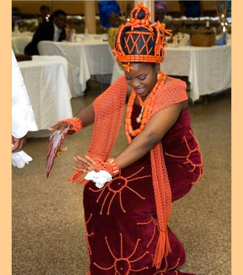 Edo Headpiece Okuku Benin wig featuring a coral beaded cap, showcasing traditional craftsmanship and elegance.