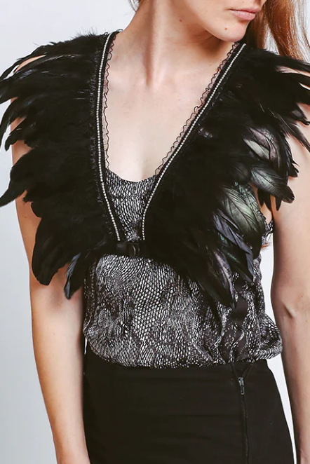 Black elastic strap bra with decorative feathers and rhinestones, featuring adjustable straps and front closure.