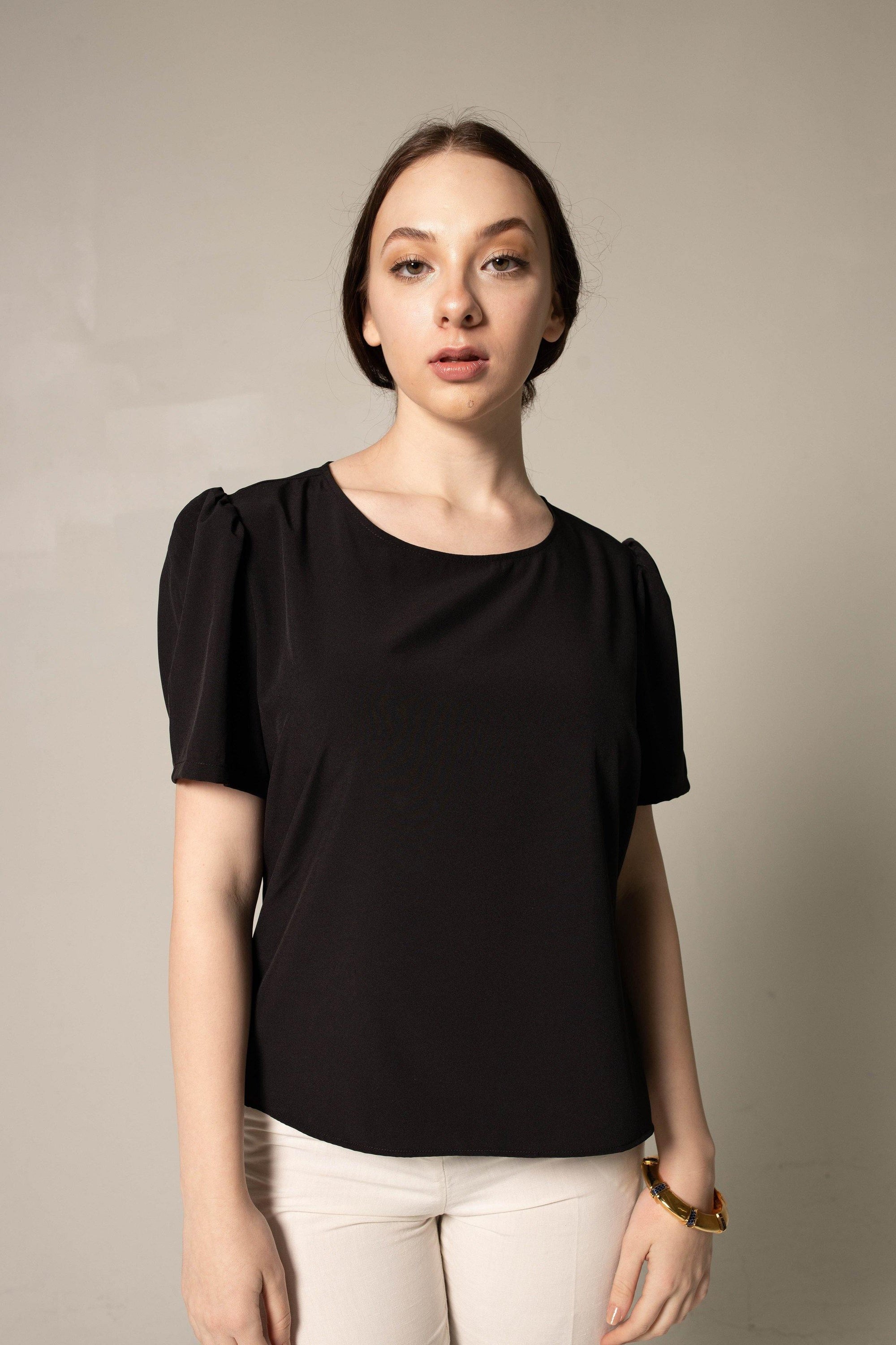 Elegance Round Neck Blouse in Black, featuring a classic round neck design, made from polyester and spandex, ideal for office and casual wear.