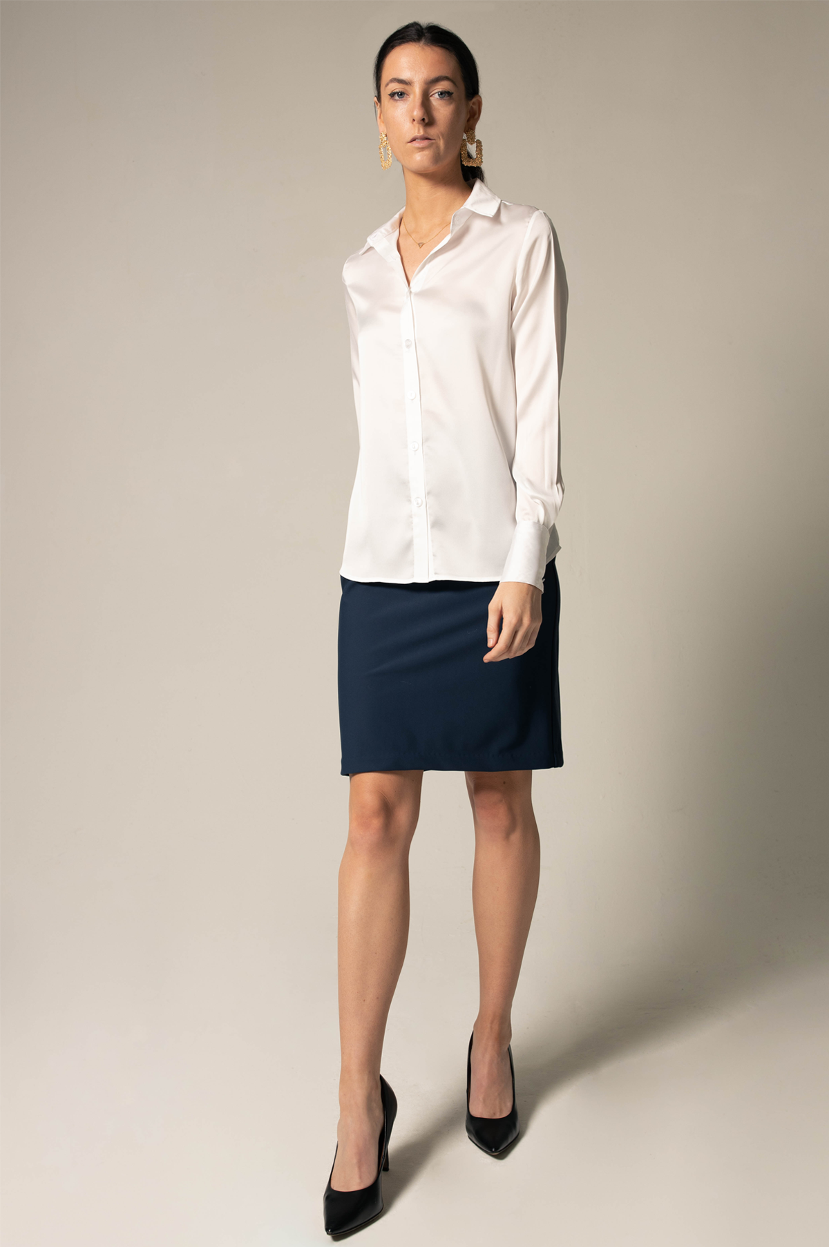 Elegance Silk Blouse in White, showcasing its luxurious silk charmeuse fabric and button-up design.