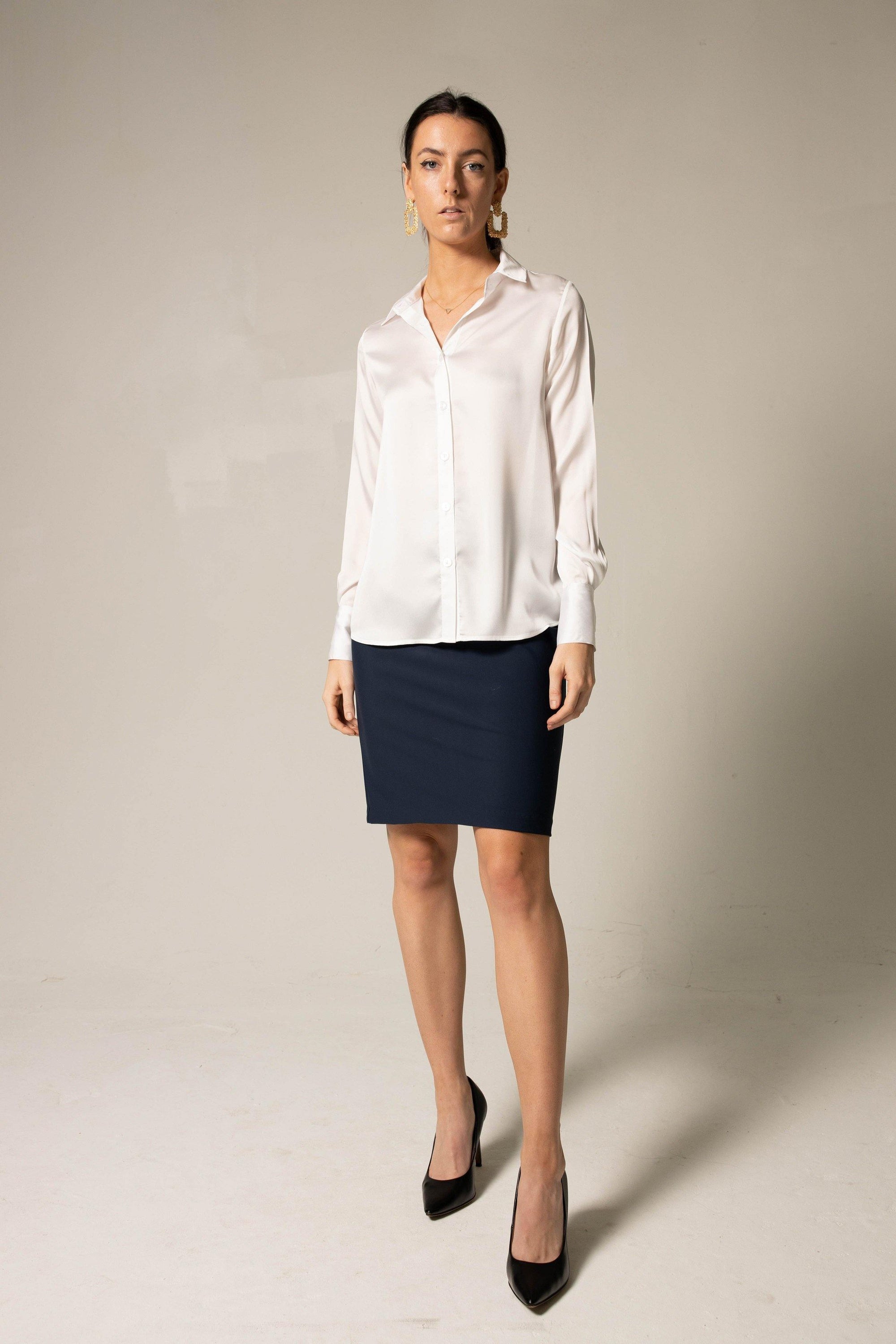 Elegance Silk Blouse in White, showcasing its luxurious silk charmeuse fabric and button-up design.