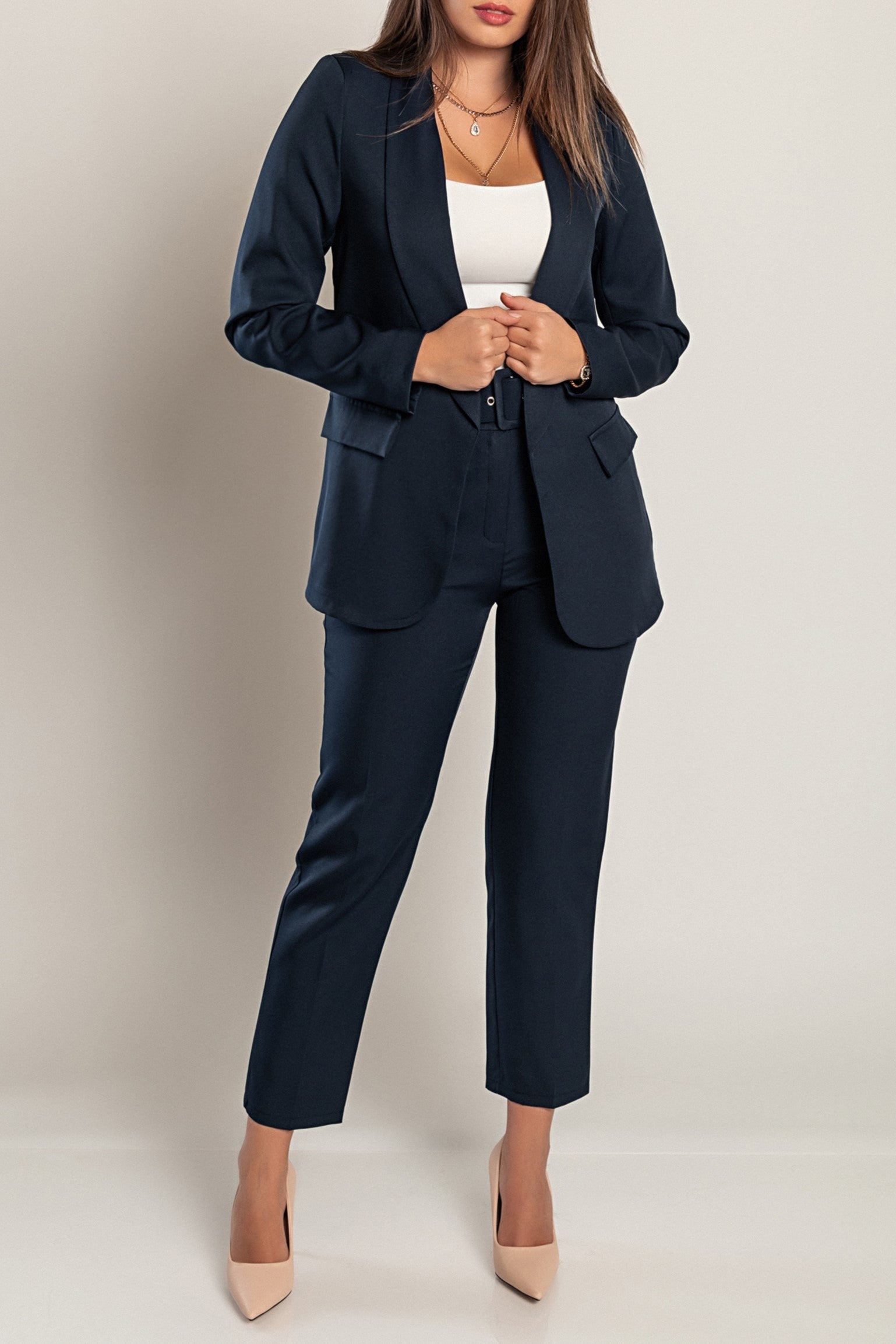 Elegant dark blue blazer and pants set, featuring long sleeves, classic collar, and attached belt, made in Italy.