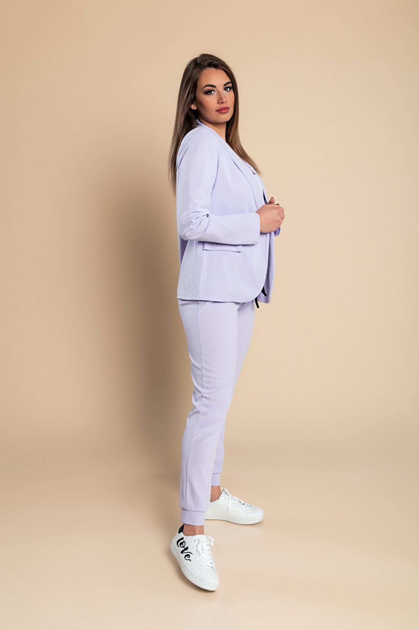 Elegant lilac blazer and pants set, featuring a classic collar, long sleeves, and fitted trousers with a drawstring waist.