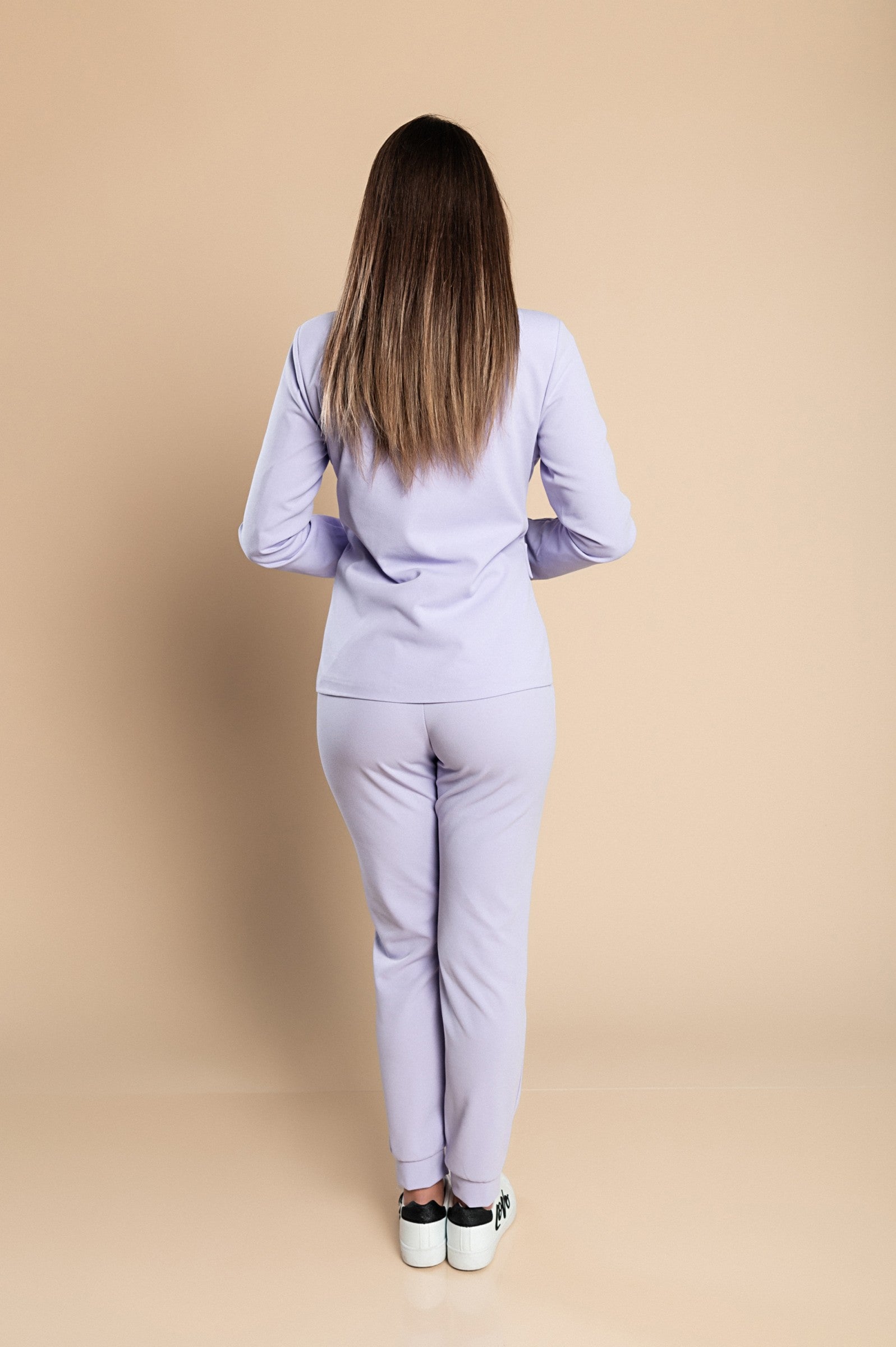 Elegant lilac blazer and pants set, featuring a classic collar, long sleeves, and fitted trousers with a drawstring waist.