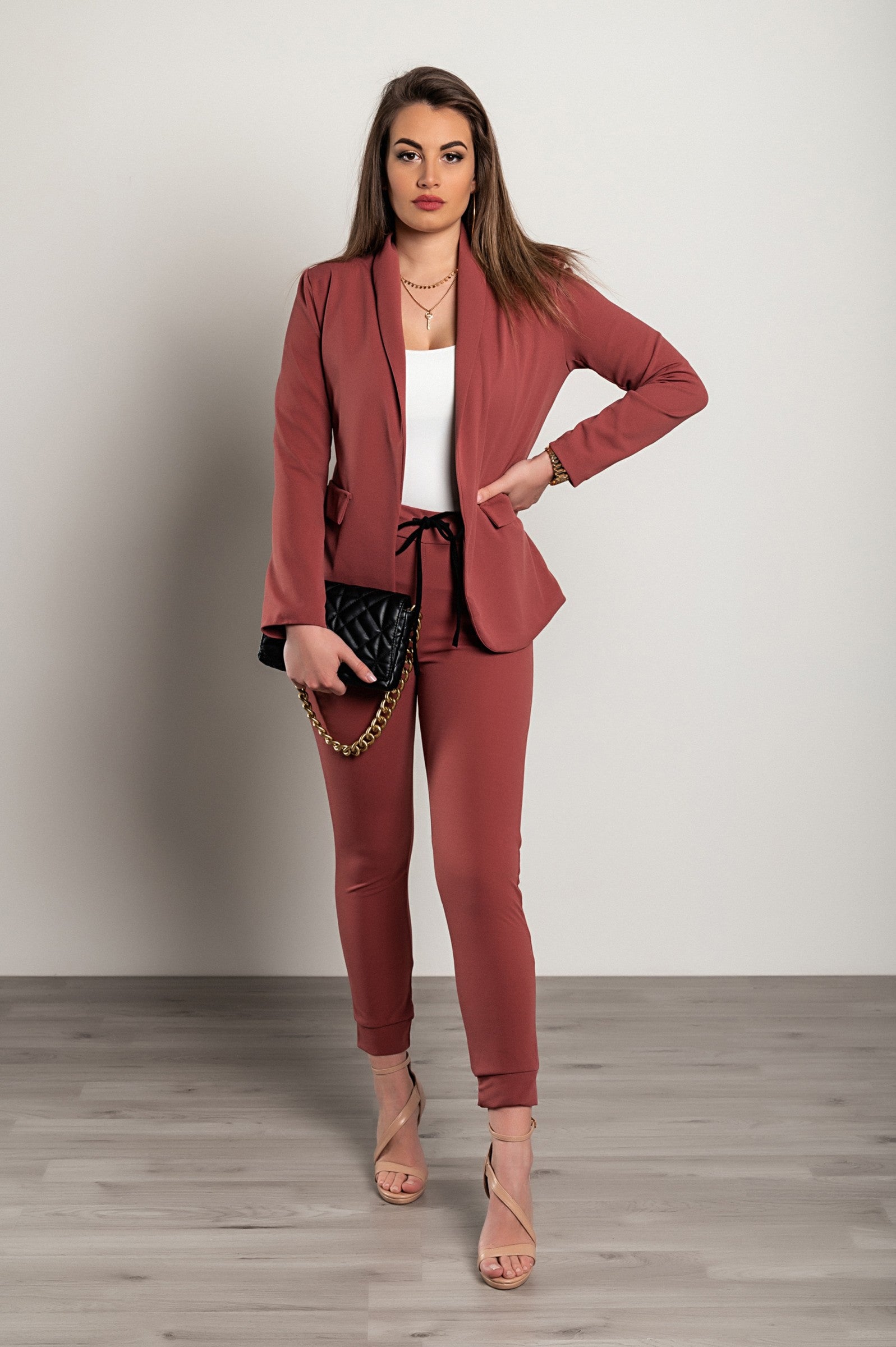 Elegant salmon blazer and pants set, featuring a classic collar, long sleeves, and fitted trousers with a drawstring waist, made in Italy.