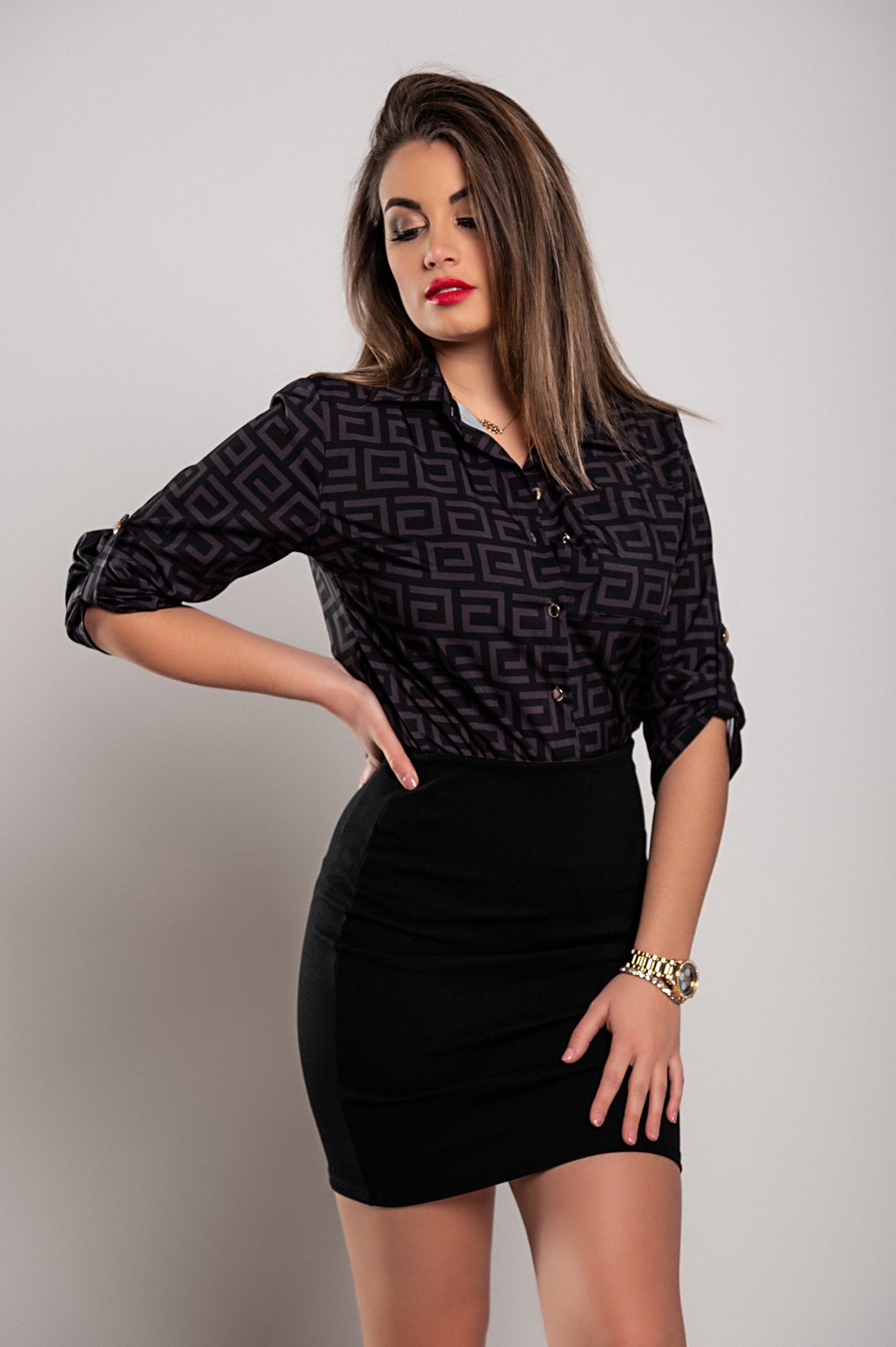 Elegant black blouse by Lavlenta featuring a trendy geometric print, classic collar, and long sleeves, made from high-quality imitation satin.