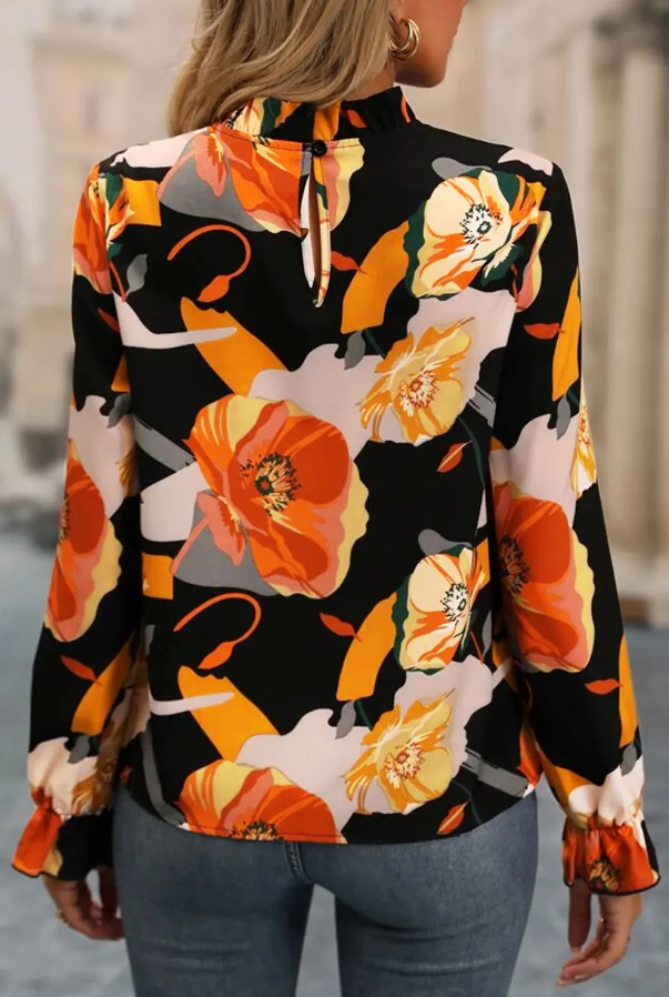 Elegant black high neck blouse with floral print and long sleeves, featuring a loose fit and cuffed wrists.