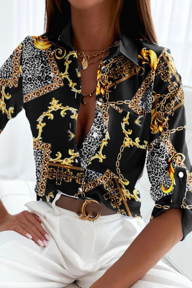 Elegant black blouse with geometric print, classic collar, and long sleeves, made of high-quality imitation satin.