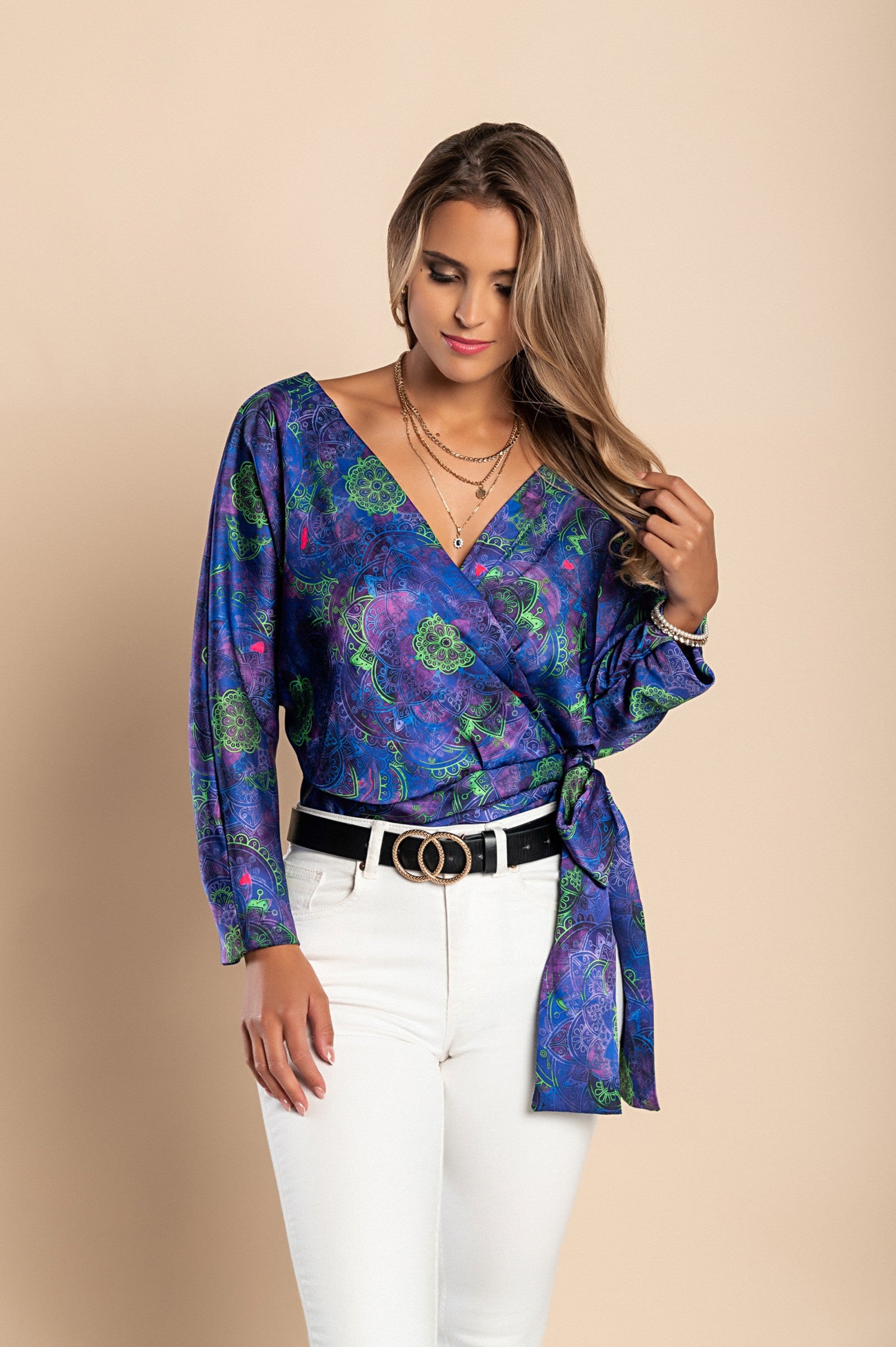 Elegant purple blouse with print, featuring a deep V neckline and bow ribbons on the side, made of high-quality faux satin.