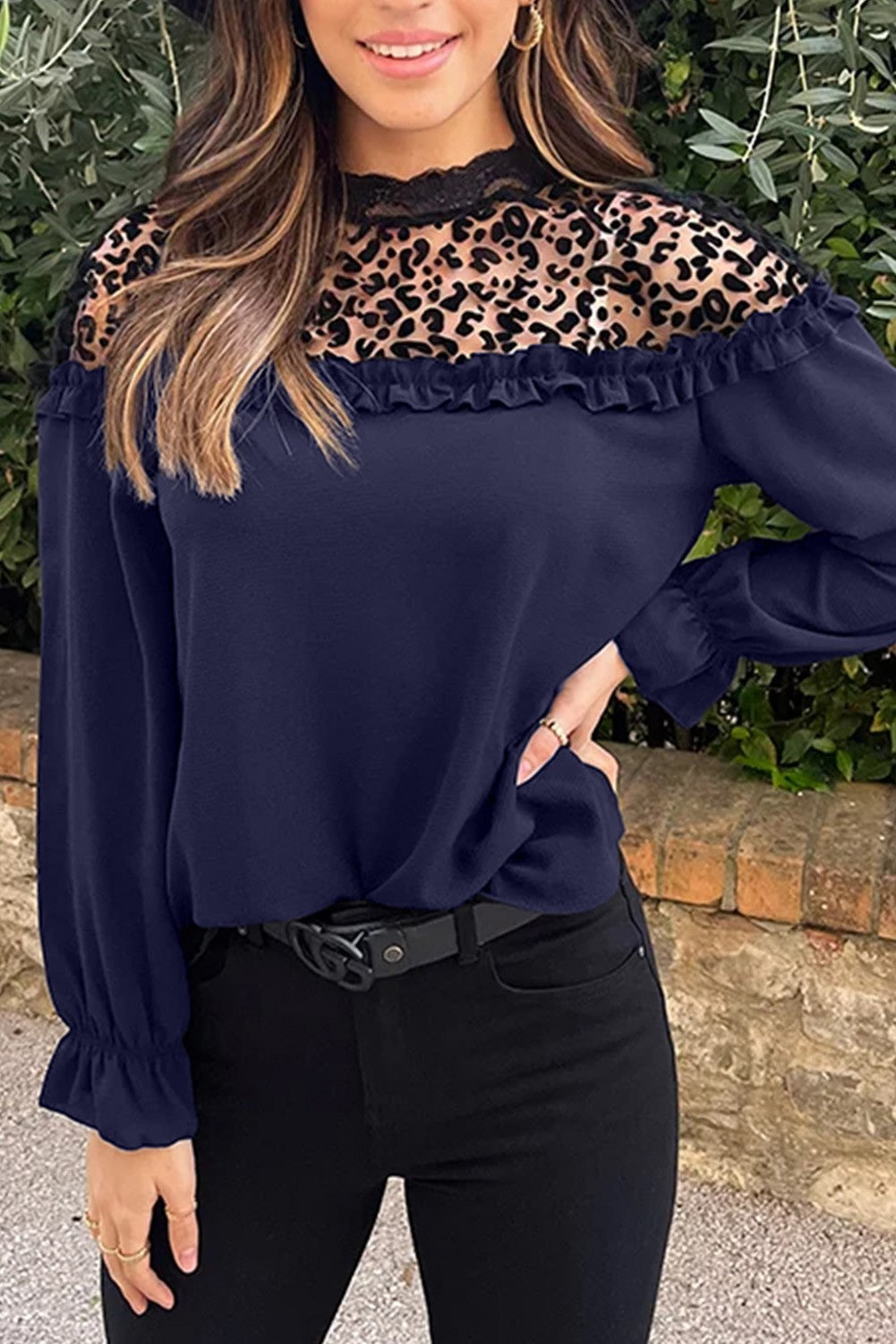 Elegant dark blue blouse with ruffles and leopard print tulle neckline, featuring long sleeves and a loose fit.