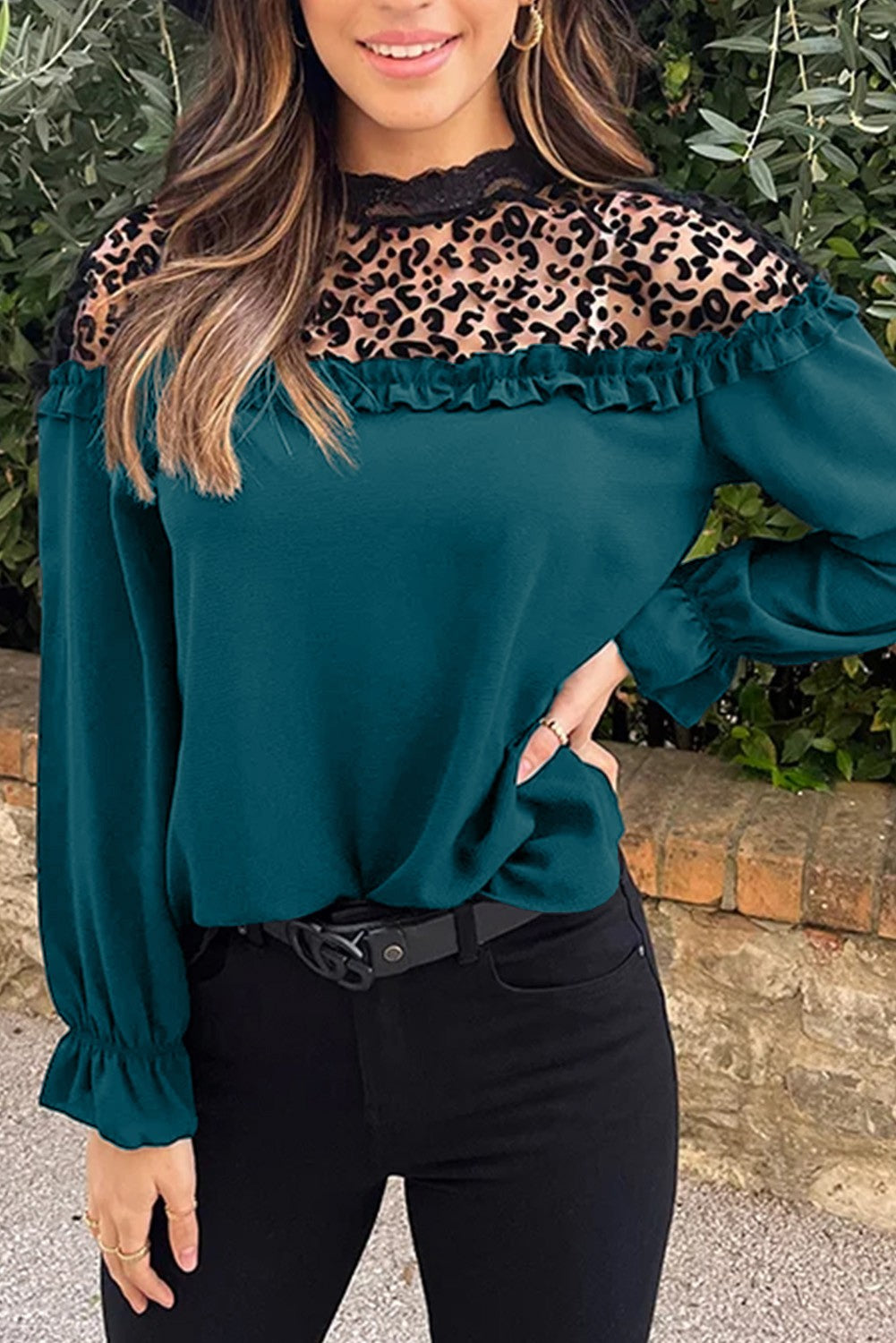 Elegant petrol blouse with ruffles and leopard print tulle neckline, featuring long sleeves and a loose fit.