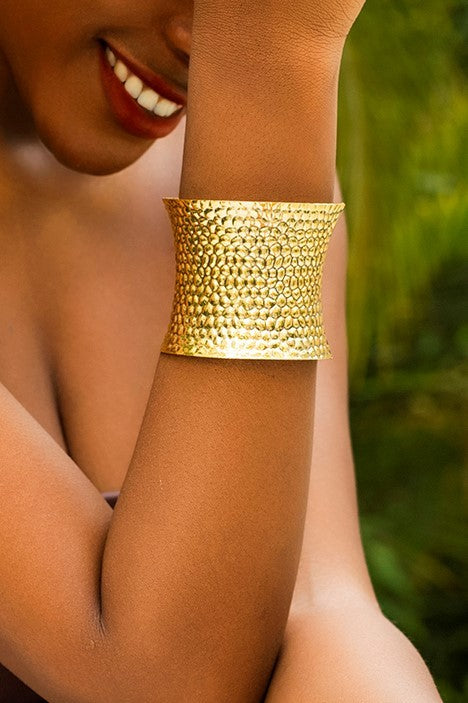 Elegant gold bracelet with a wide design, made from durable metal alloy, perfect for enhancing any outfit.