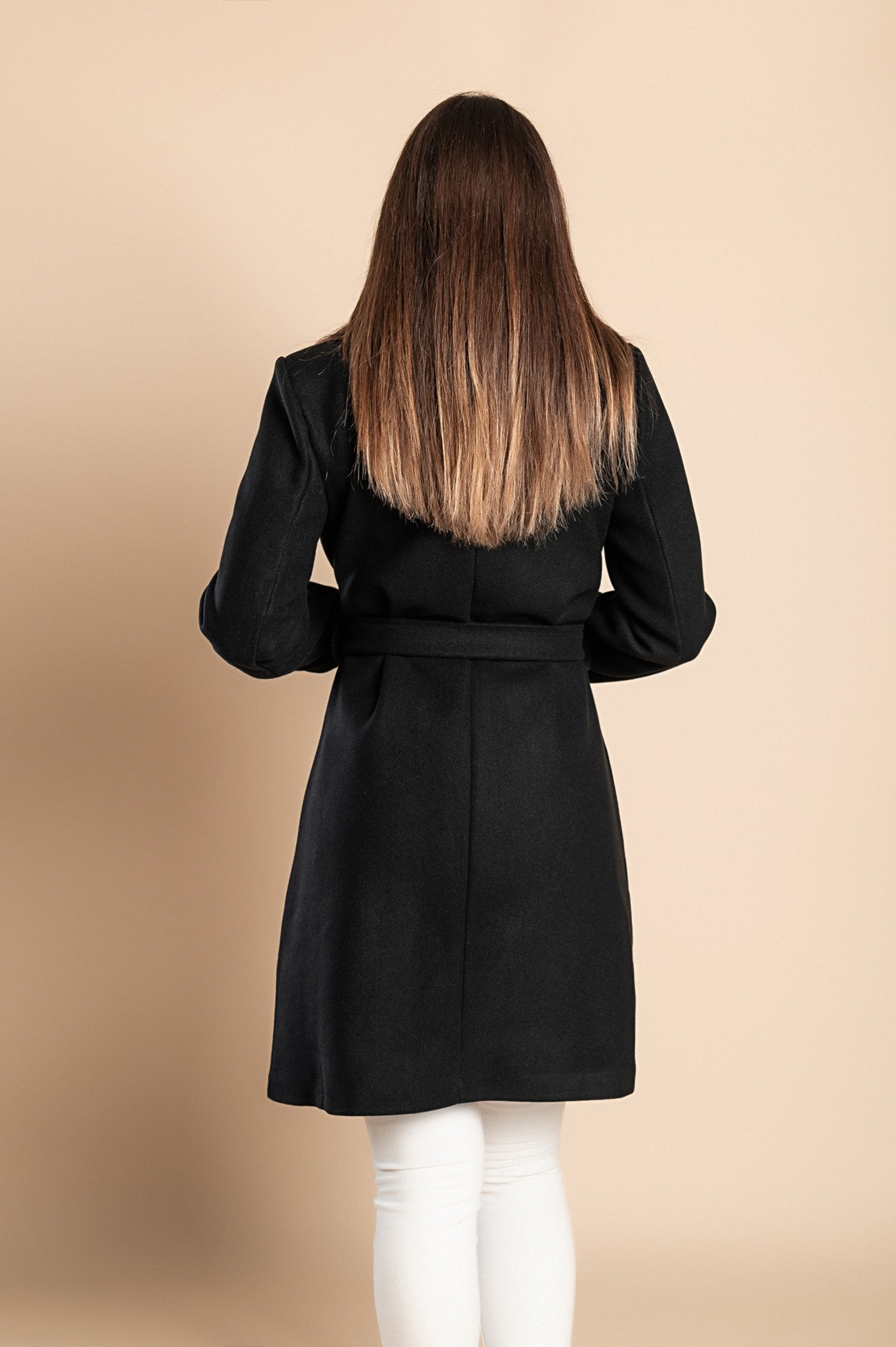 Elegant black coat with buttons, featuring a high collar, long sleeves, and a decorative belt, made from soft polyester fabric.