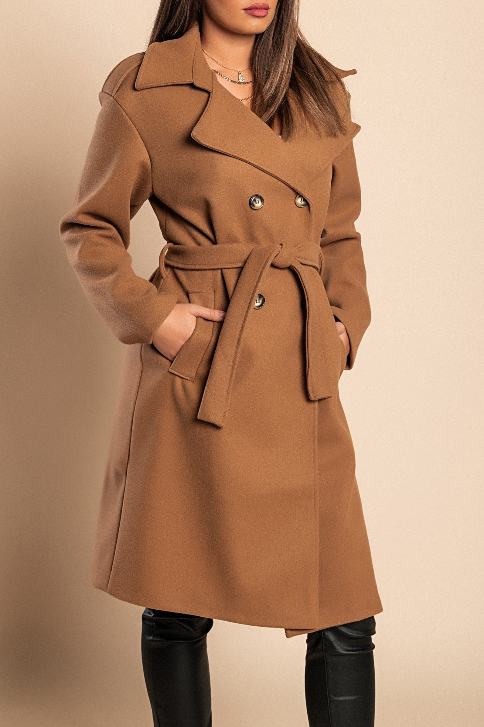 Elegant camel coat with buttons, featuring a classic collar and decorative belt, knee-length design with side pockets.