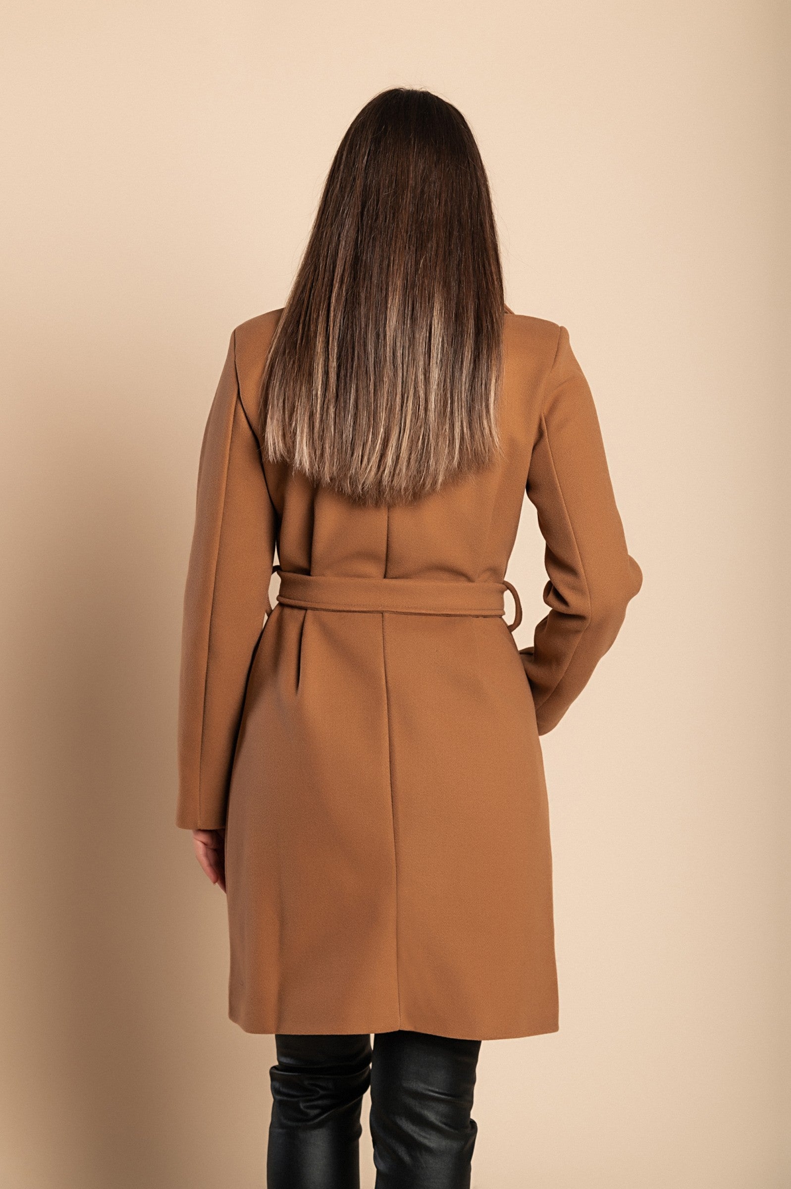 Elegant camel coat with buttons, featuring a high collar, long sleeves, and decorative belt, perfect for stylish layering.