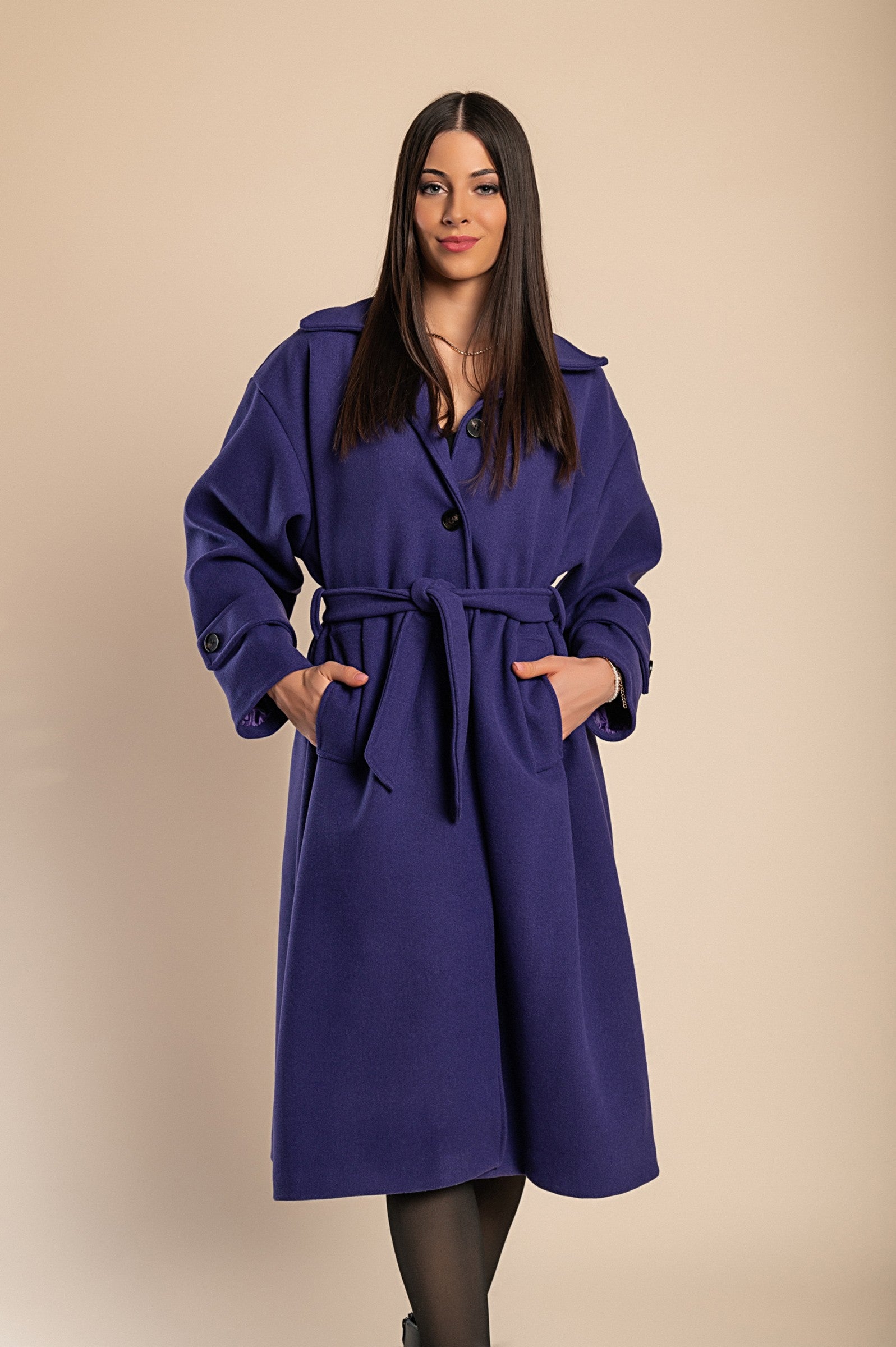 Elegant purple coat with buttons, featuring a classic collar, long sleeves, and a decorative belt, perfect for winter fashion.