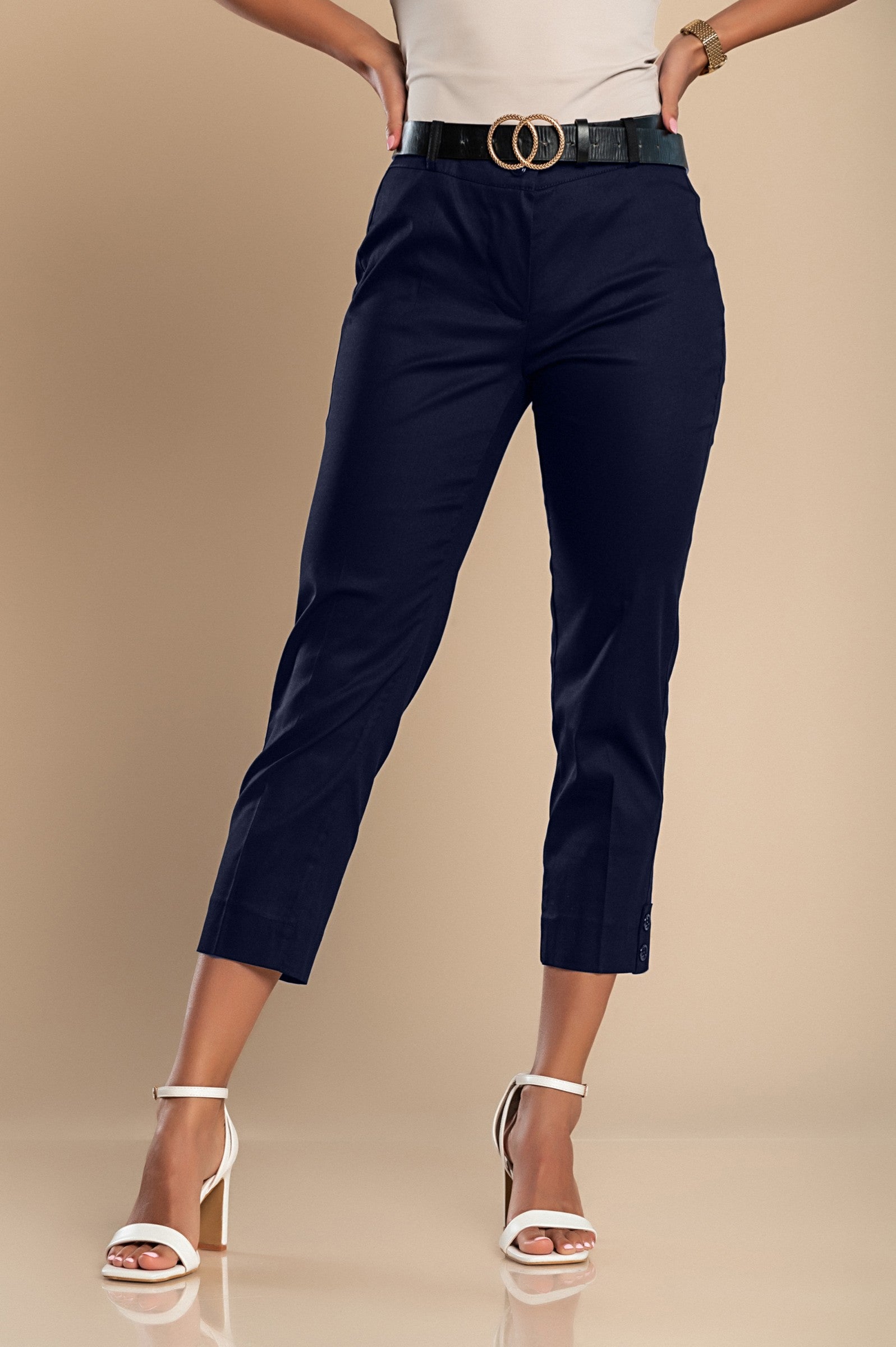 Elegant blue cotton trousers featuring decorative buttons and a zip closure, designed for comfort and style.