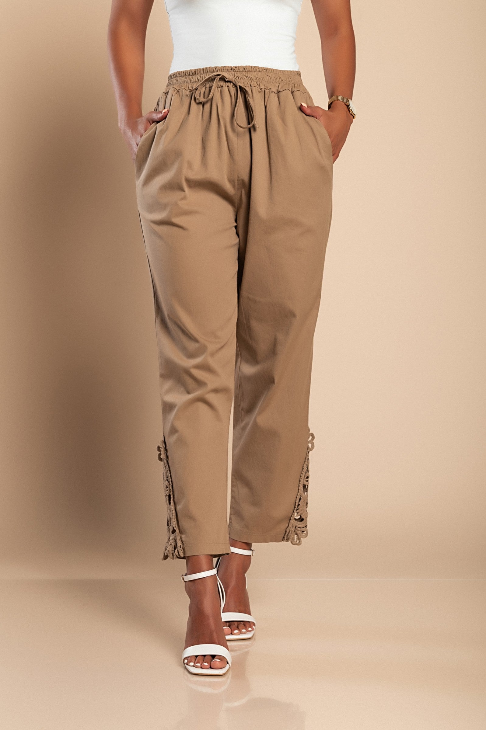 Elegant khaki cotton trousers with lace detailing, featuring an elastic and drawstring waist.