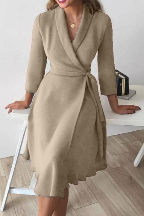 Elegant beige dress with a folding collar and 3/4 sleeves, featuring a deep V neckline and a loose mid-thigh skirt.