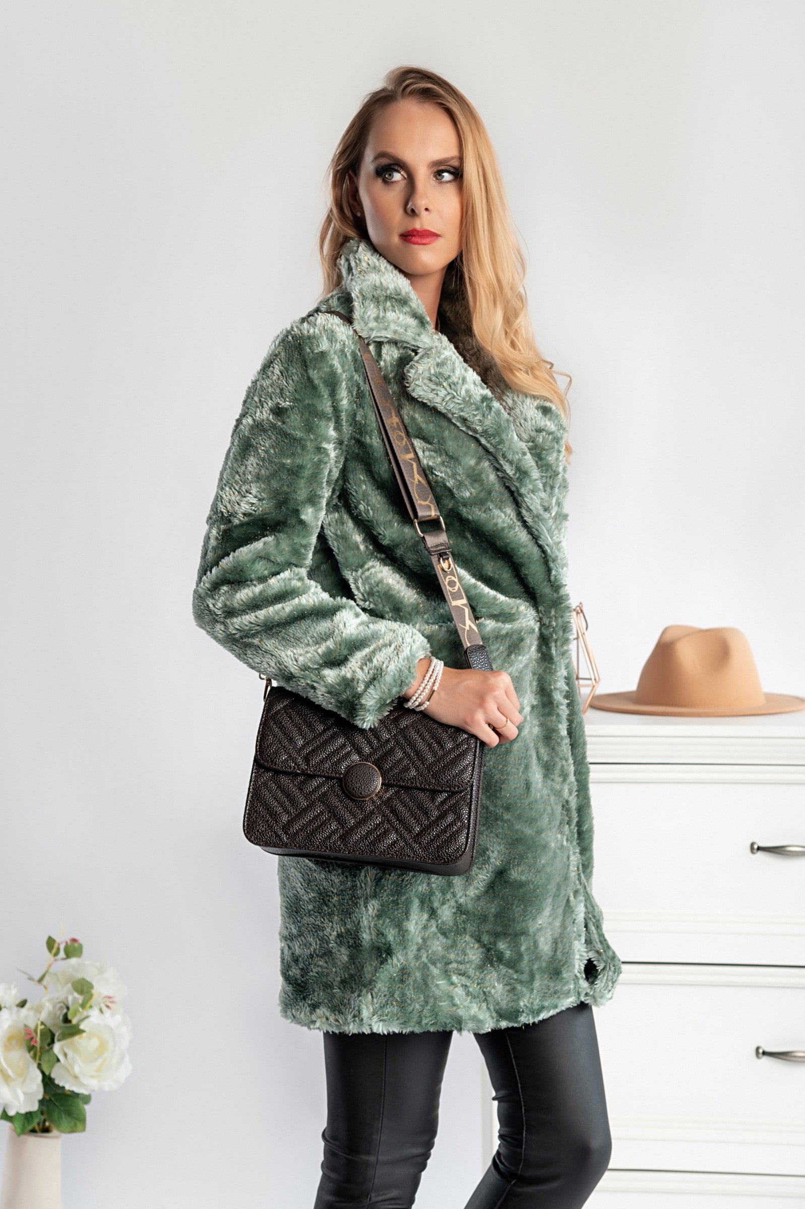 Elegant green faux fur coat Alamena with classic collar and front pockets, featuring a hood lined with soft faux fur.