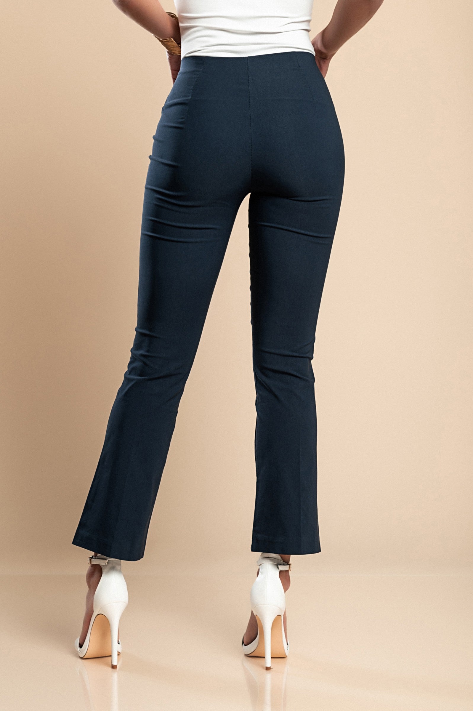 Elegant dark blue flared leg trousers with a middle belt, showcasing a stylish 7/8 length and flared hem, made in Italy.