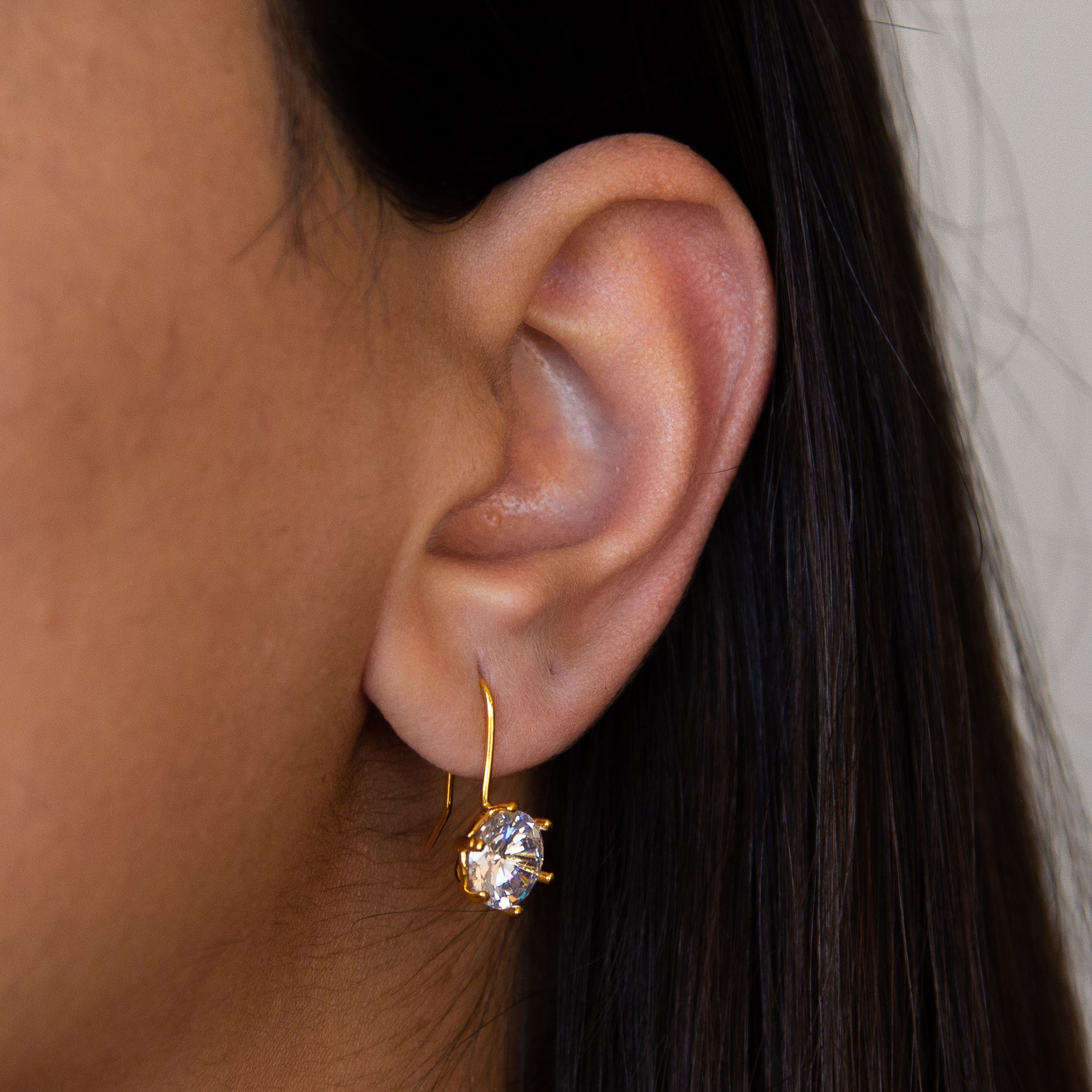 Elegant Golden Sparkle Drops earrings showcasing intricate design and luxurious golden finish.