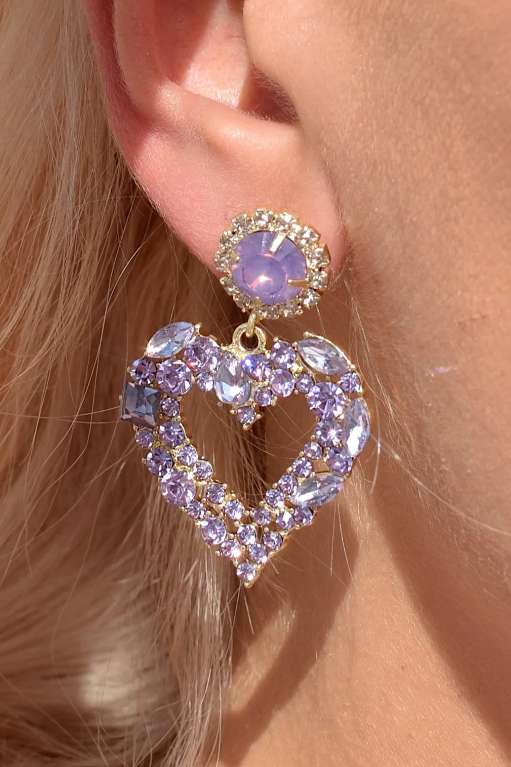 Elegant pink heart-shaped earrings with decorative diamonds, showcasing a stylish design perfect for any occasion.