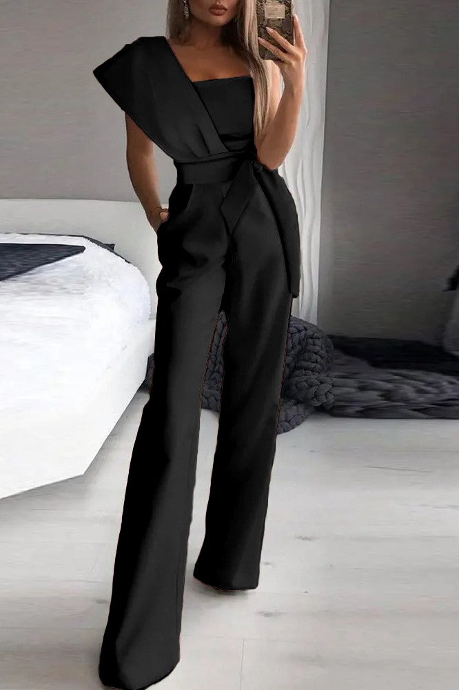 Elegant Black Jumpsuit Chia with asymmetrical neckline and one sleeve, showcasing a stylish design suitable for various occasions.