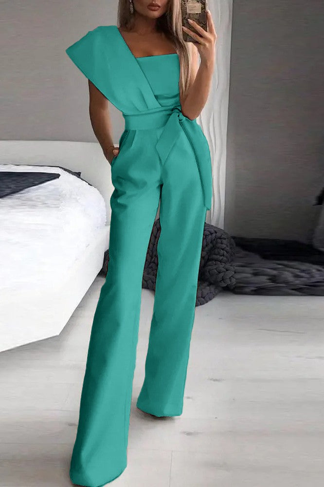 Elegant Mint Jumpsuit Chia featuring asymmetrical neckline and one sleeve, made from soft fabric with long loose pants.