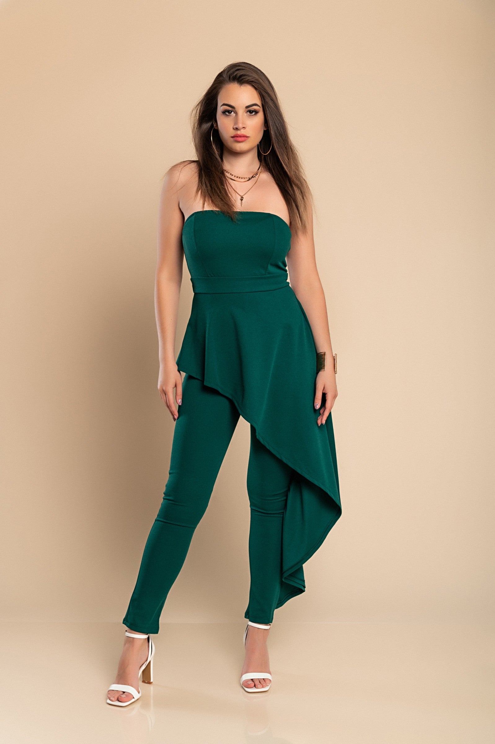 Elegant green jumpsuit Ema featuring asymmetric skirt detail and zipper closure, made in Italy.