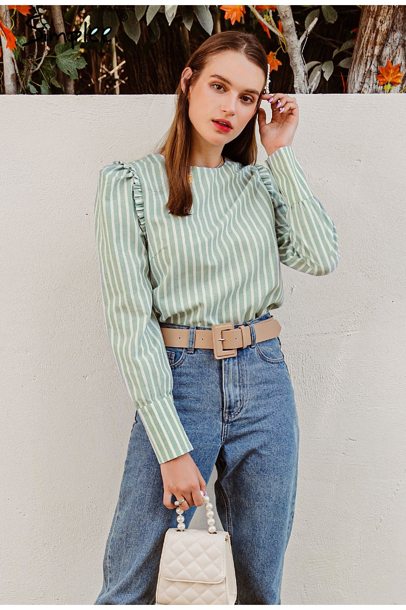 Elegant light green blouse for women with ruffles and puff sleeves, perfect for autumn and winter office wear.