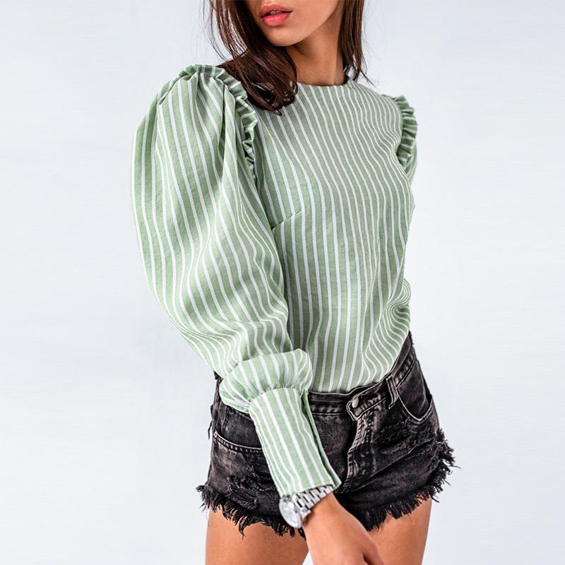 Elegant light green blouse for women with ruffles and puff sleeves, perfect for autumn and winter office wear.