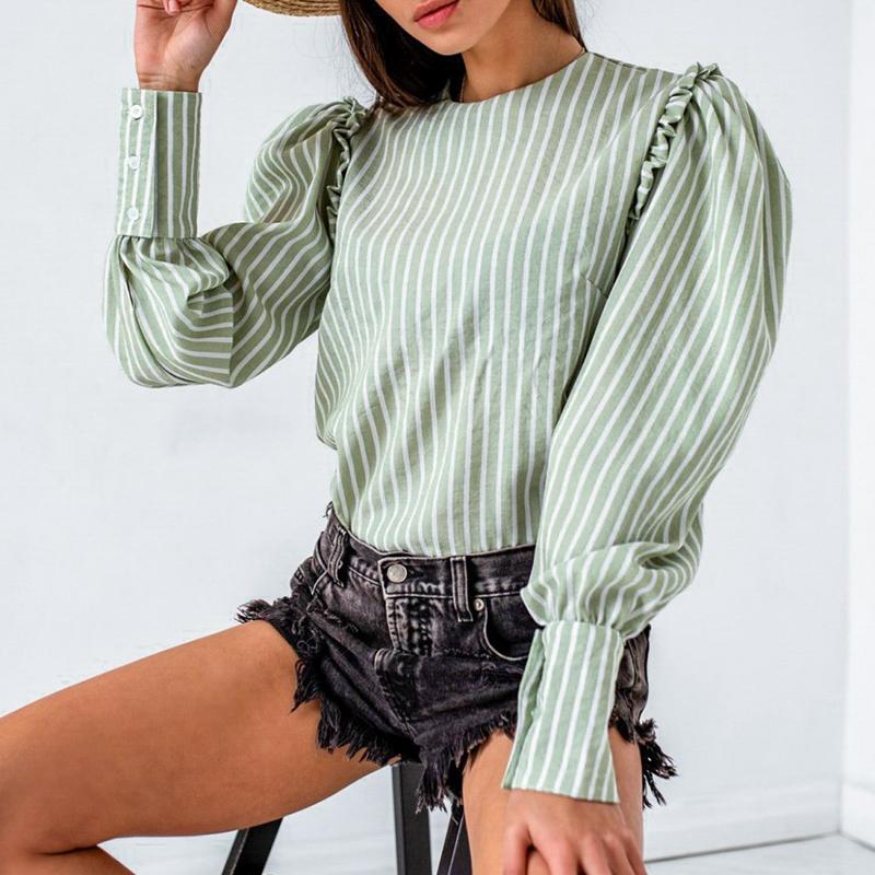 Elegant light green blouse for women with ruffles and puff sleeves, perfect for autumn and winter office wear.